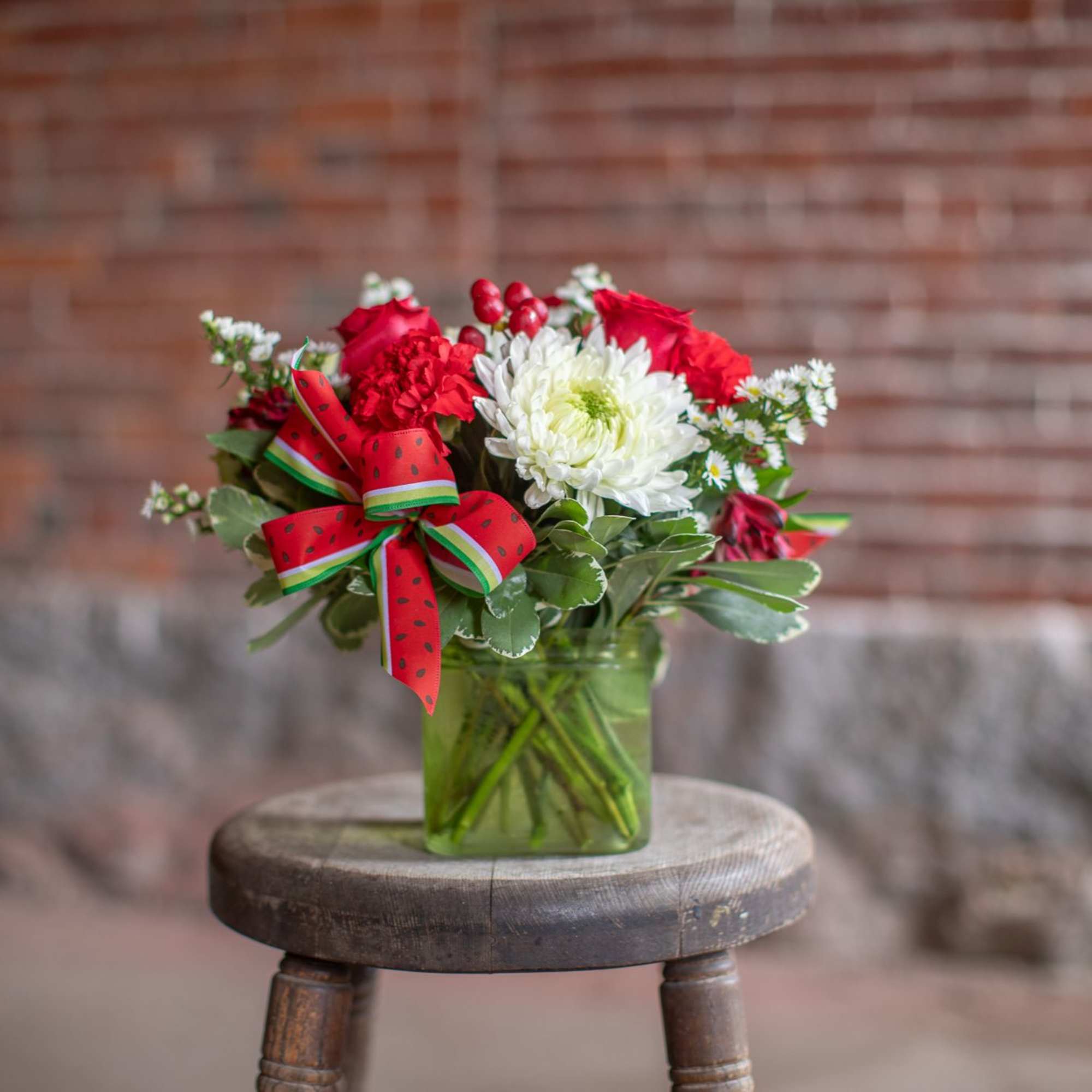 A fresh design of roses, cremons, carnations and button poms are arranged, photo 3 of 4