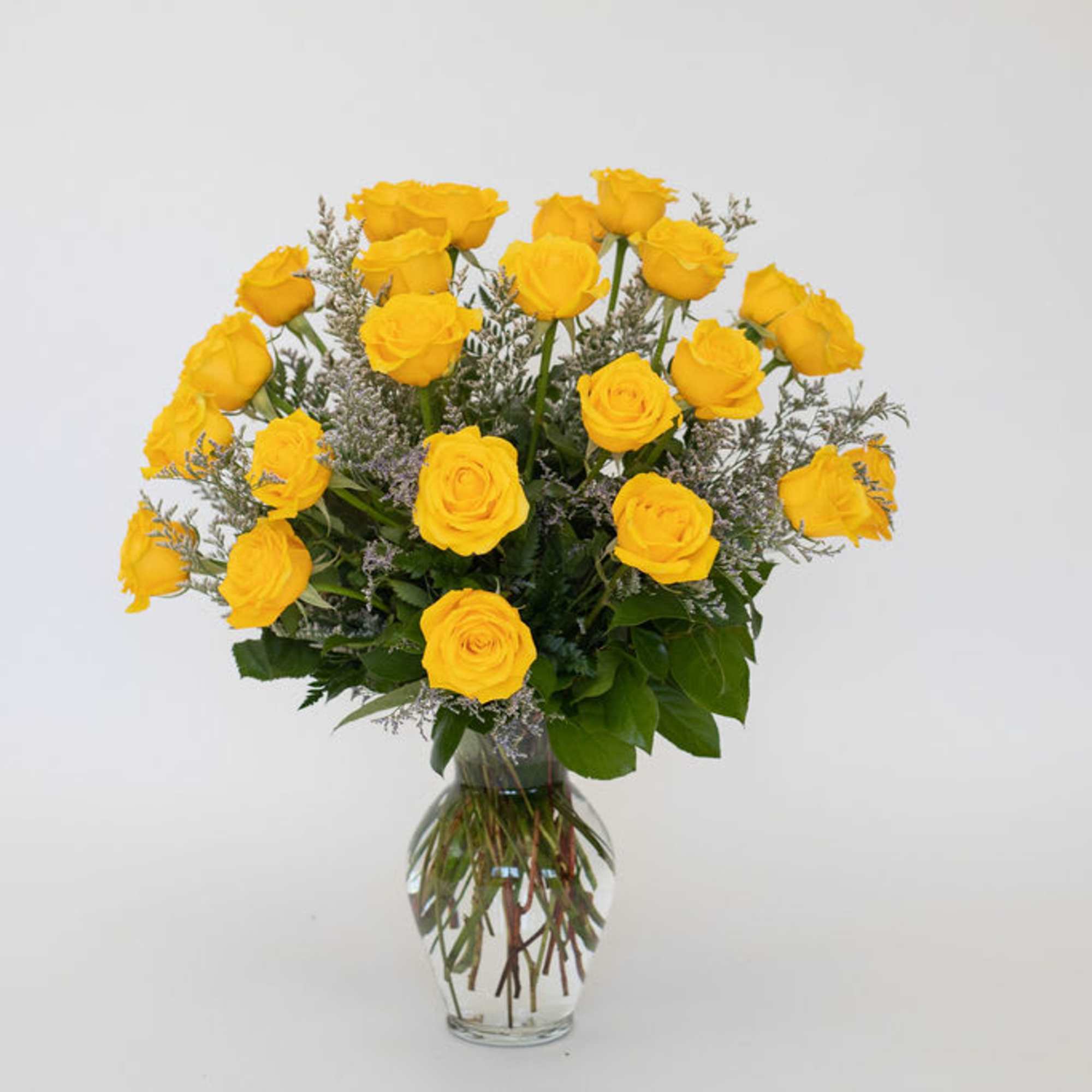 Yellow roses arranged in a clear glass vase, photo 2 of 3