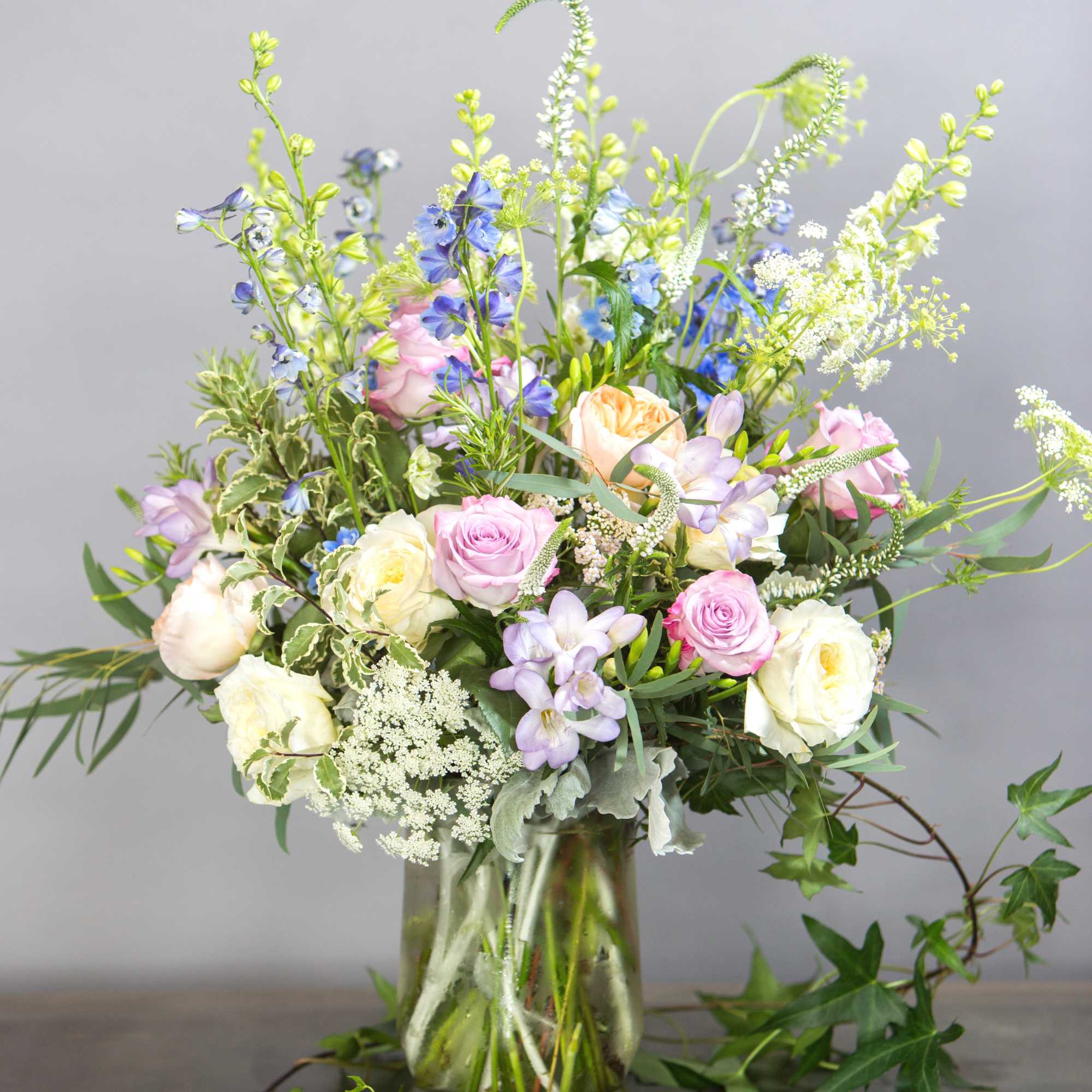 Mixed pastel bouquet in a clear glass vase