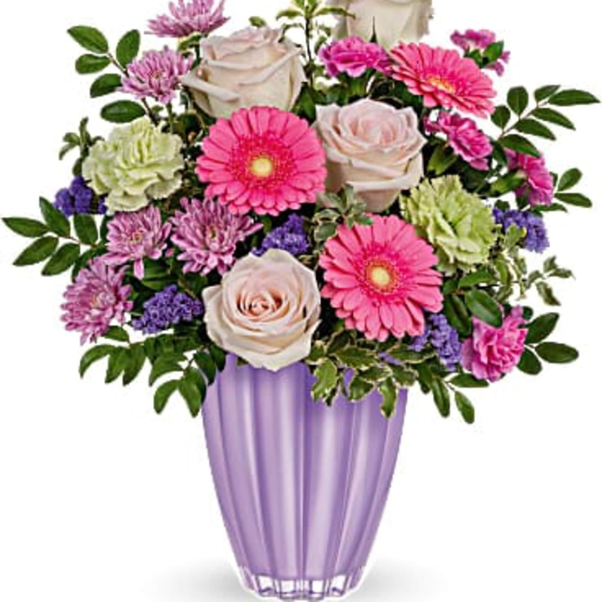 Pink and white flowers arranged in a purple vase
