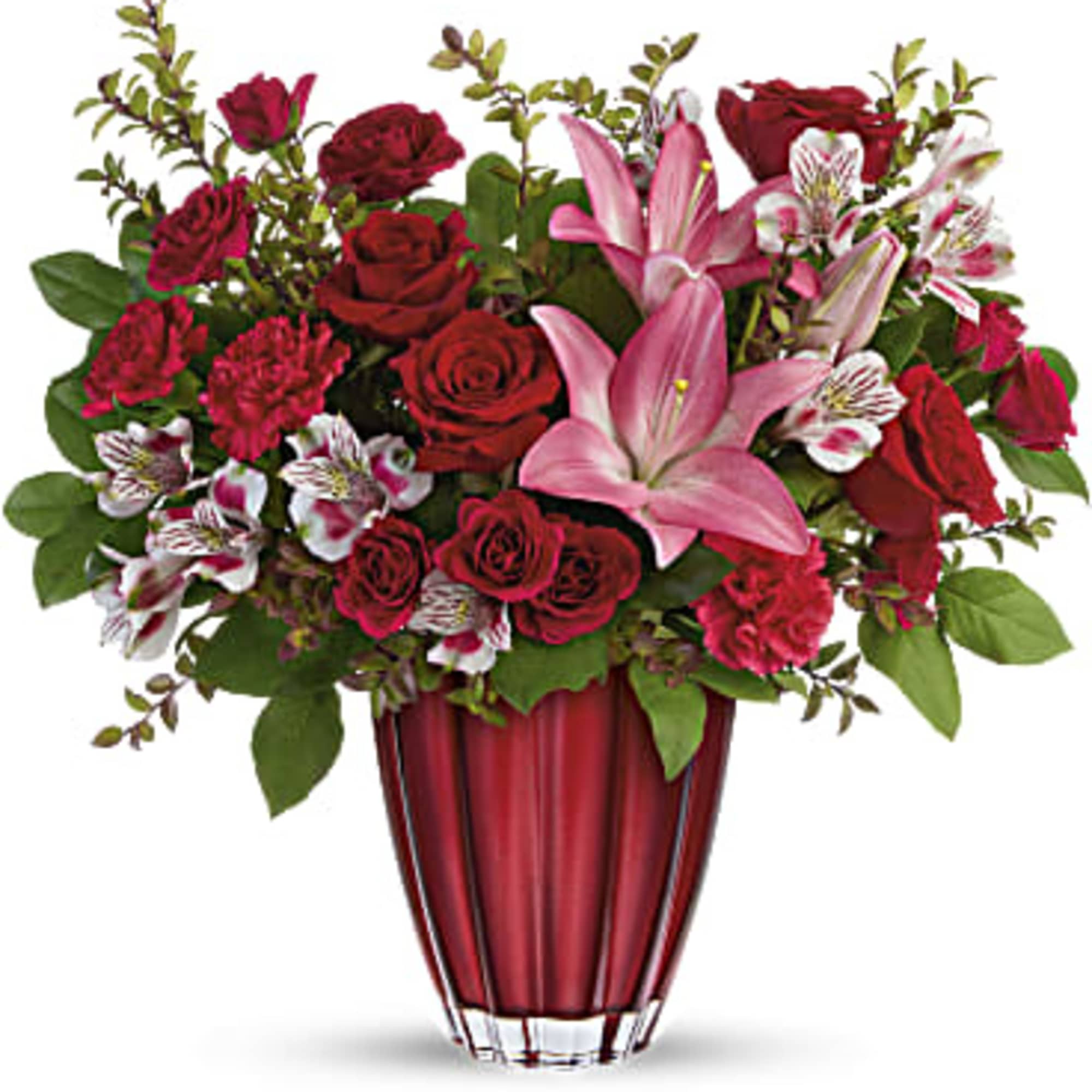 Red roses and pink lilies arranged in a red glass vase