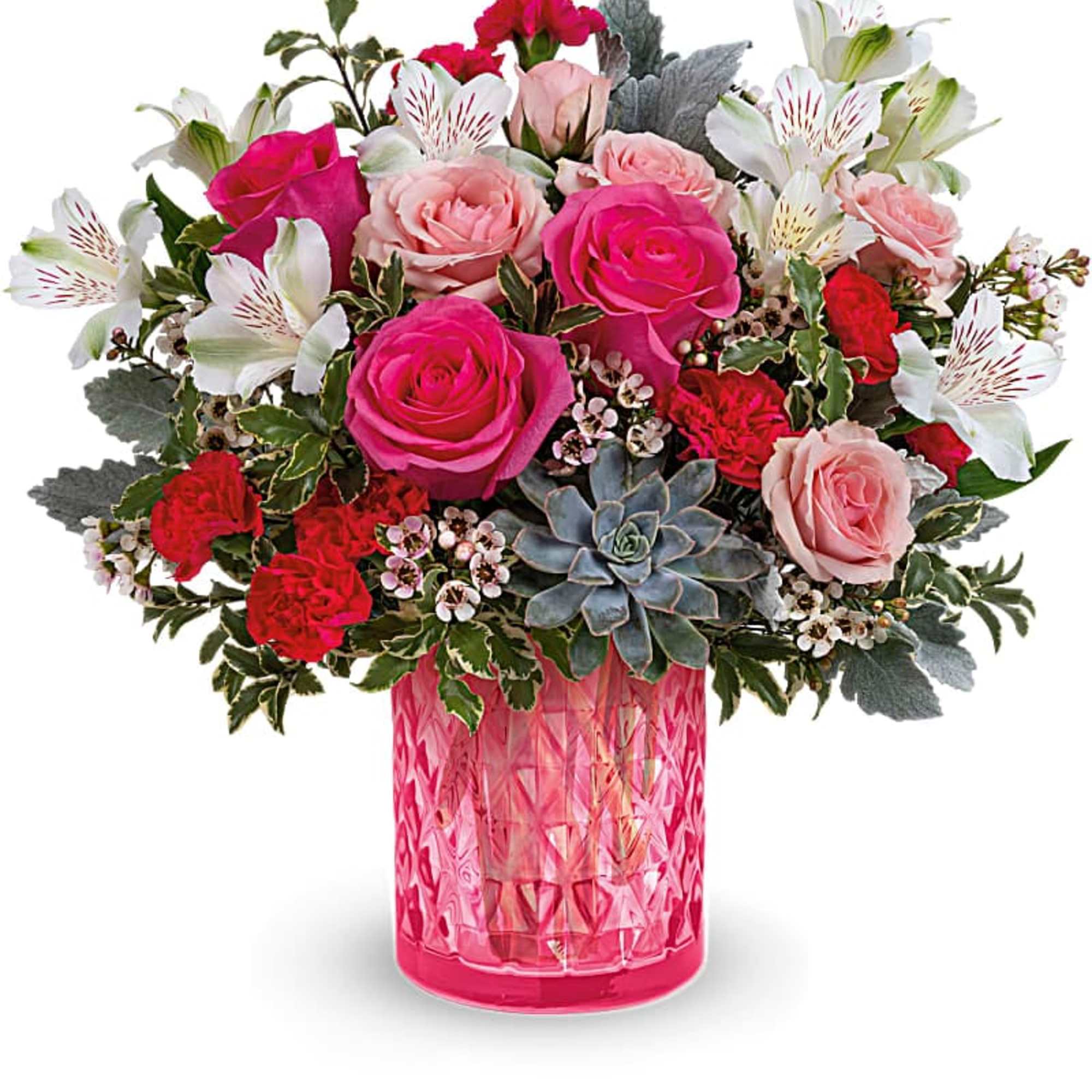 Pink and white mixed flower bouquet in a pink glass vase