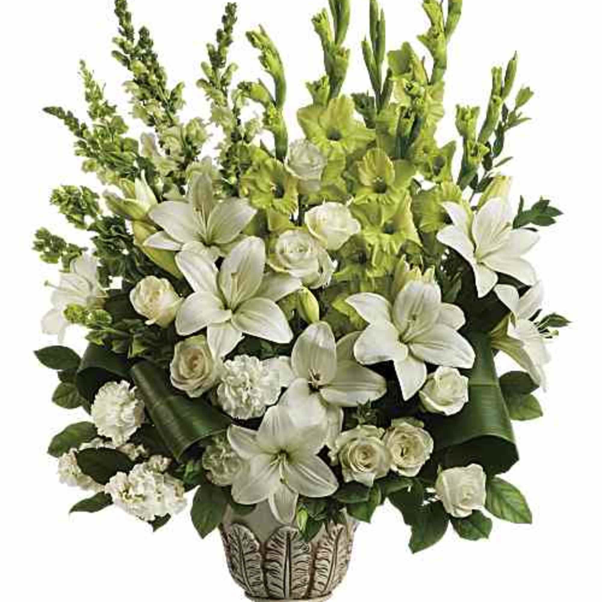 White lilies and roses arranged in a decorative pedestal vase