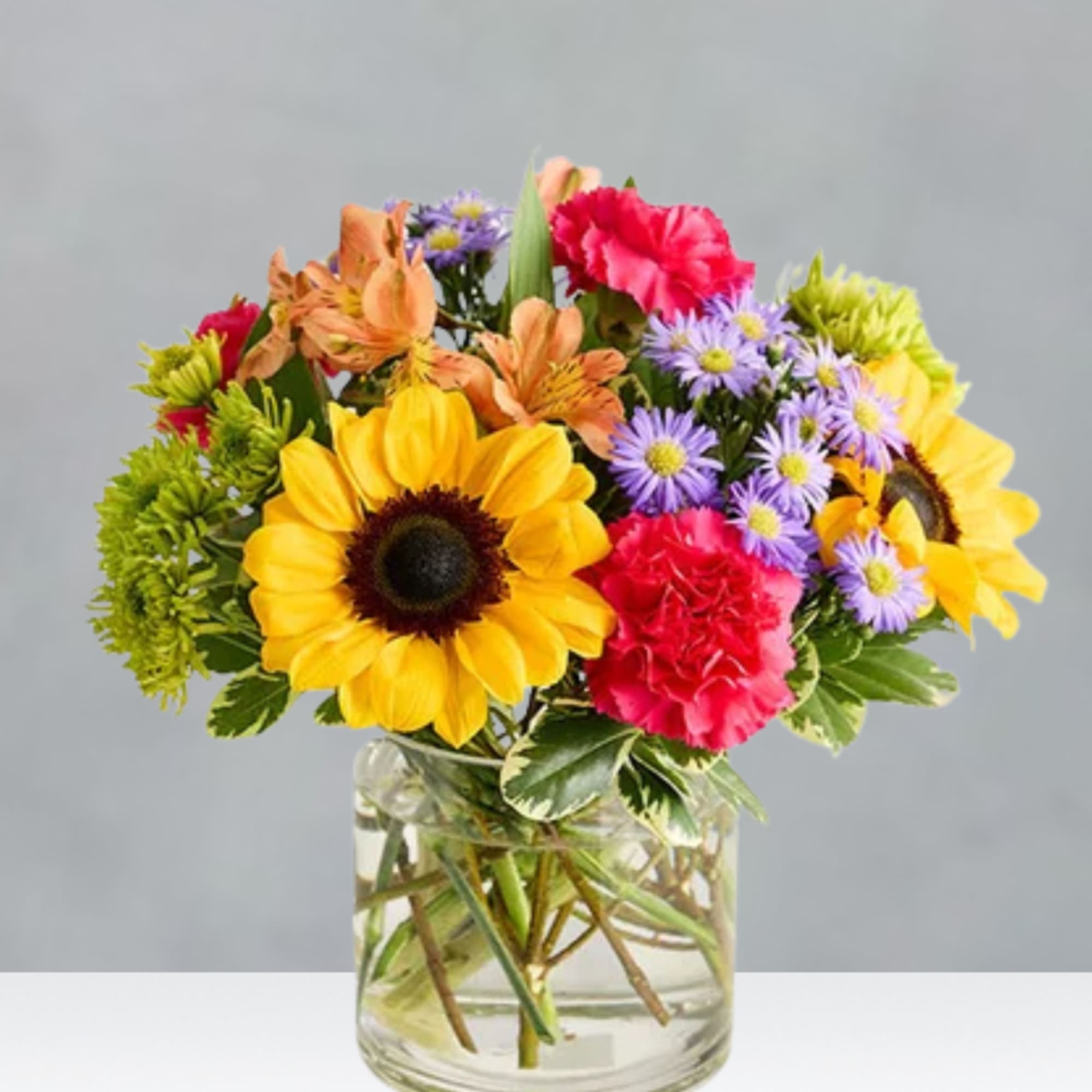 Colorful mixed bouquet in a clear glass vase