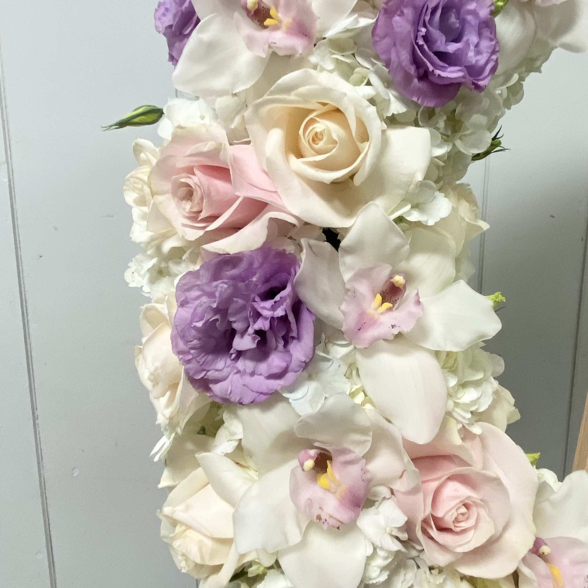 Tall bouquet of white, blush, and purple flowers