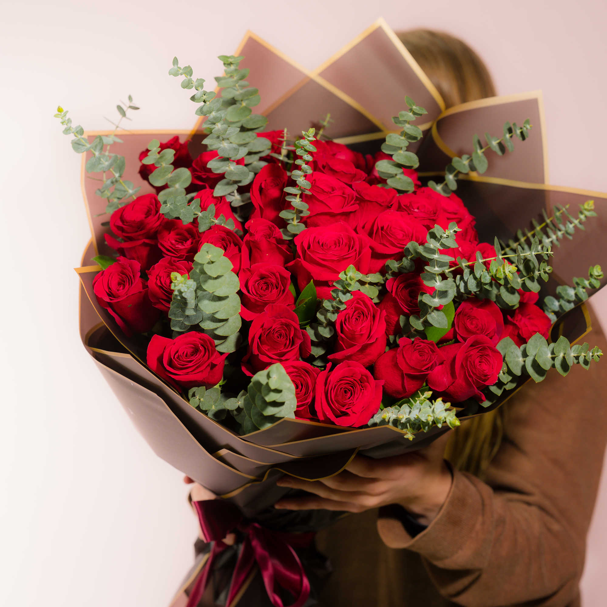 Bouquet of red roses with eucalyptus in dark wrapping, photo 5 of 5