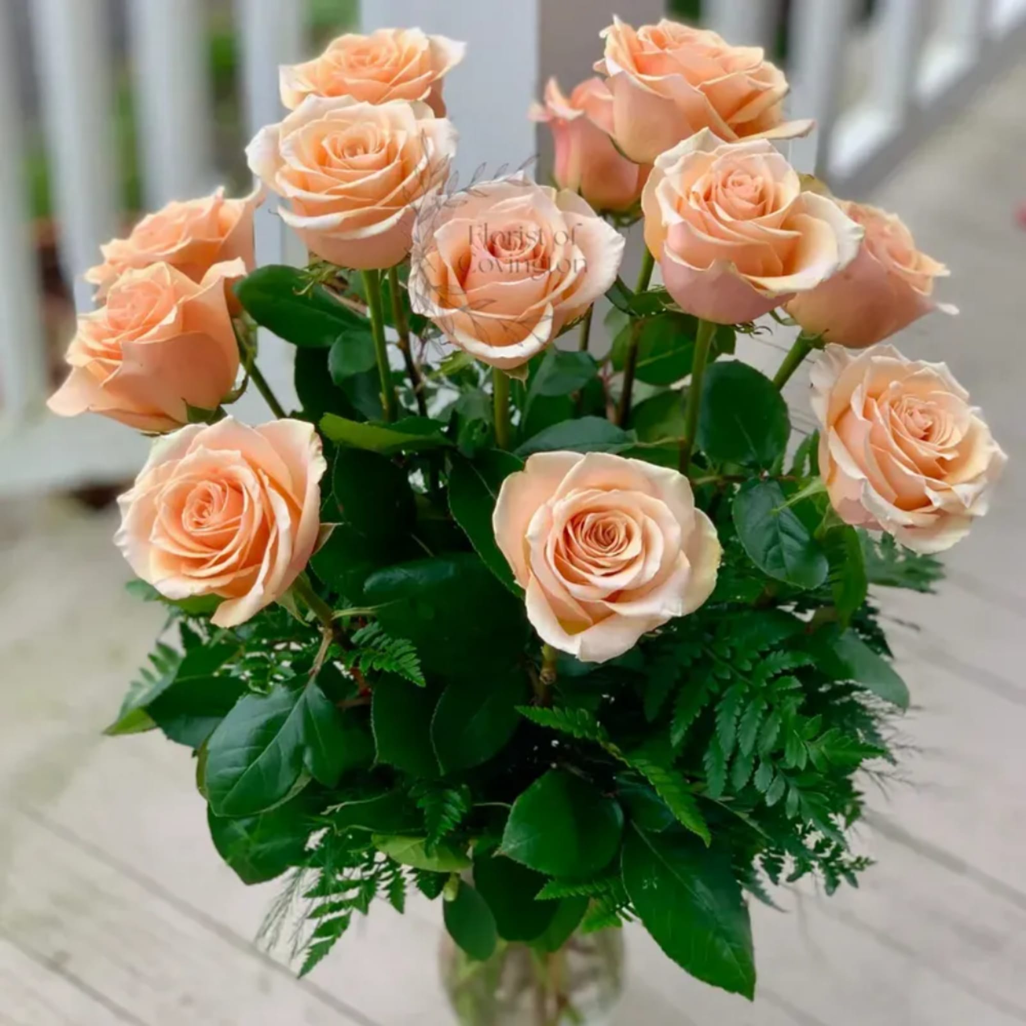 Bouquet of peach roses with green foliage