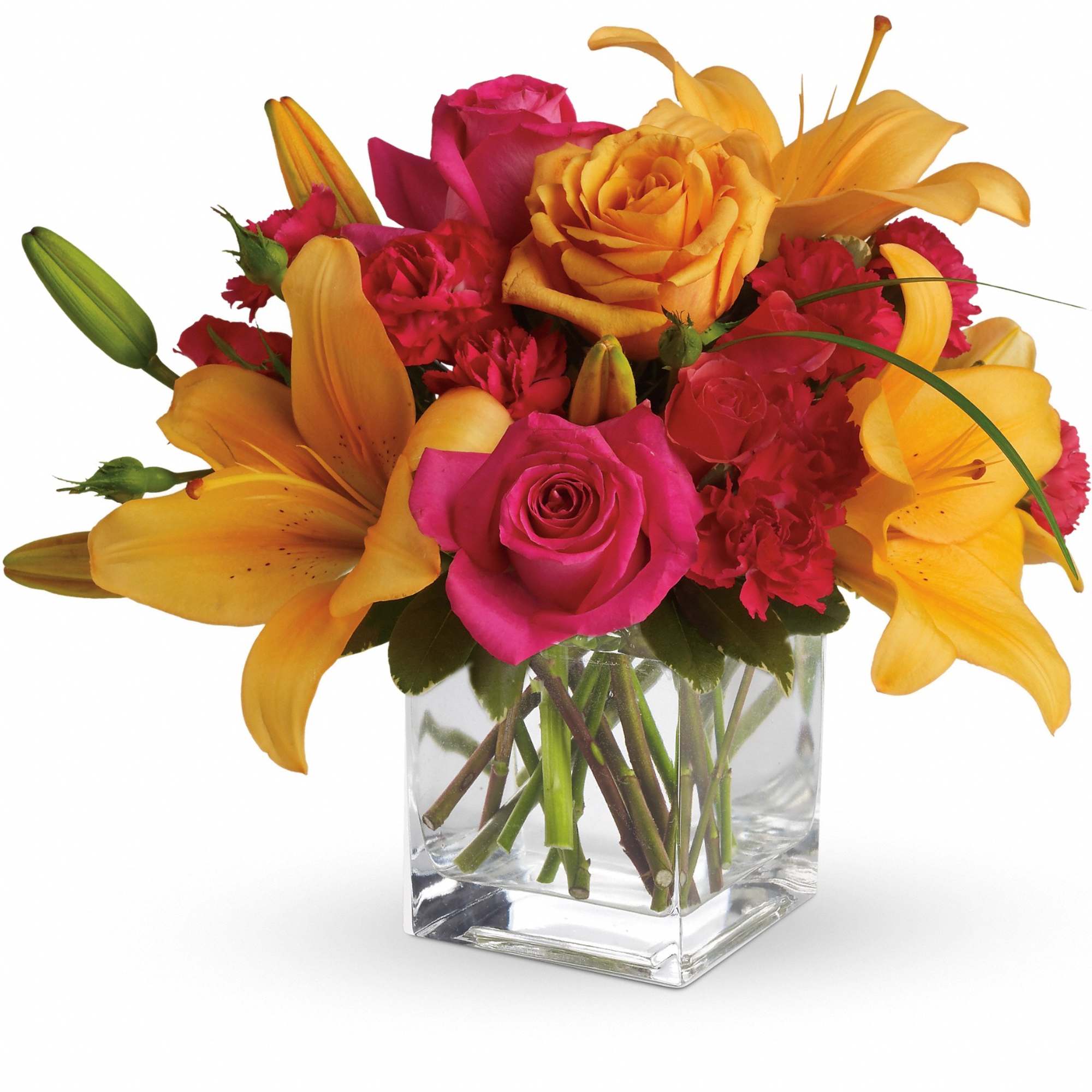 Bouquet of pink roses, yellow lilies, and red carnations in a clear glass vase