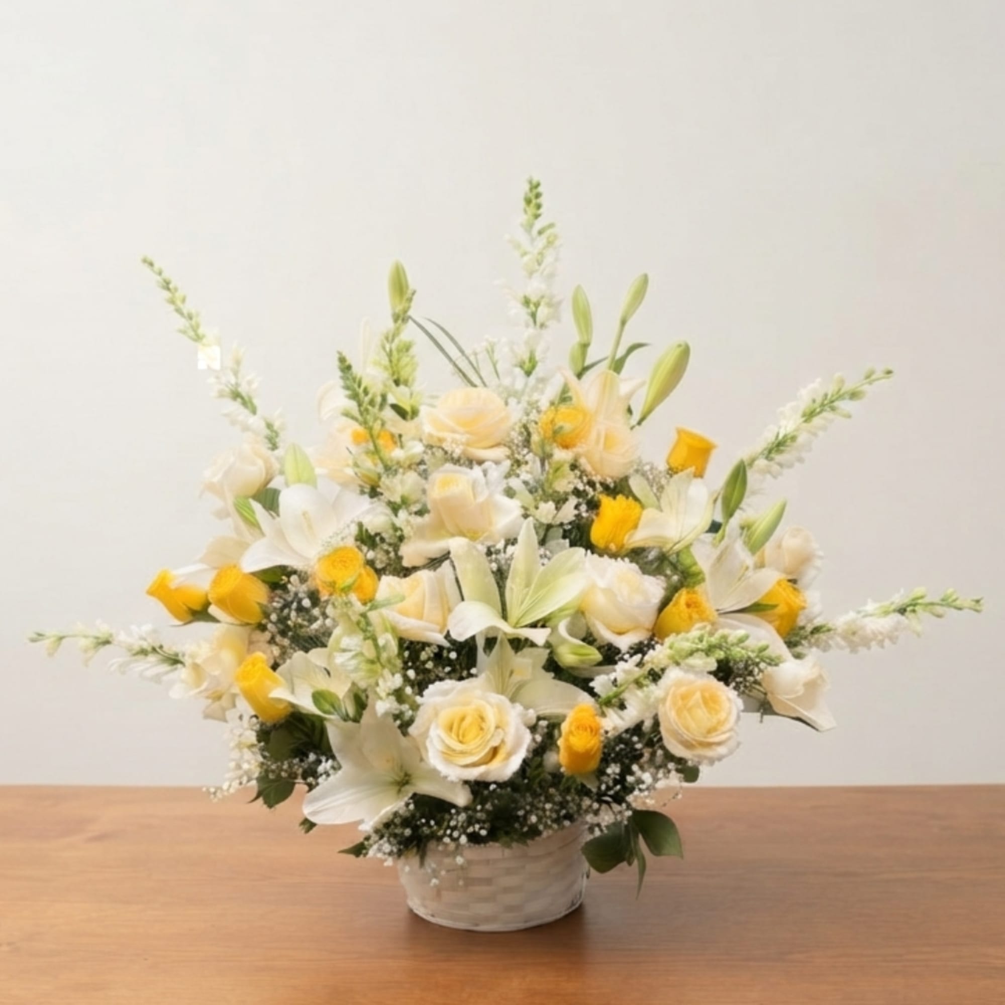 White and yellow floral arrangement in a woven basket, photo 2 of 2