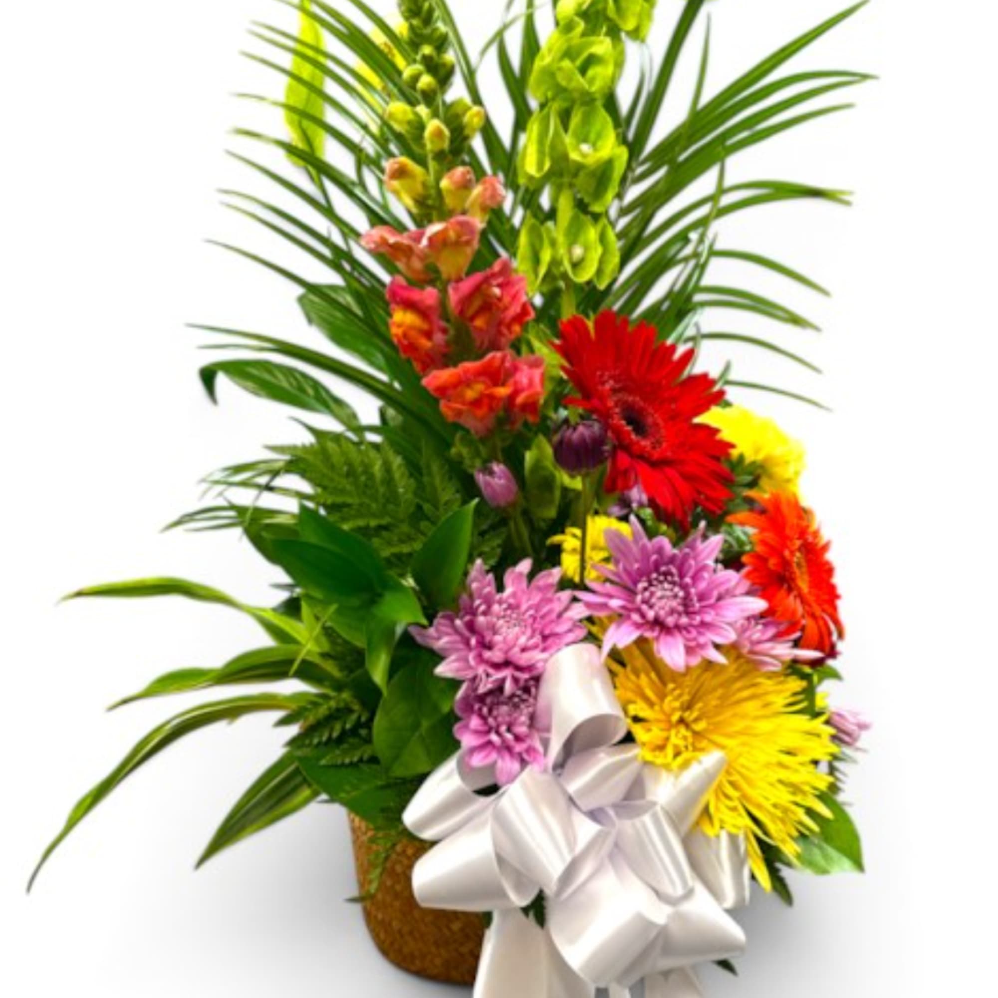 Colorful mixed flower arrangement with a white ribbon bow in a basket