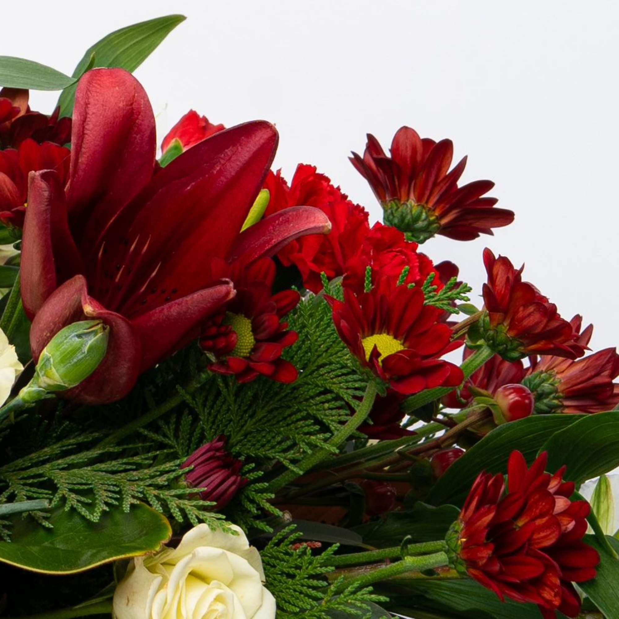 Red and white mixed bouquet with roses and daisies