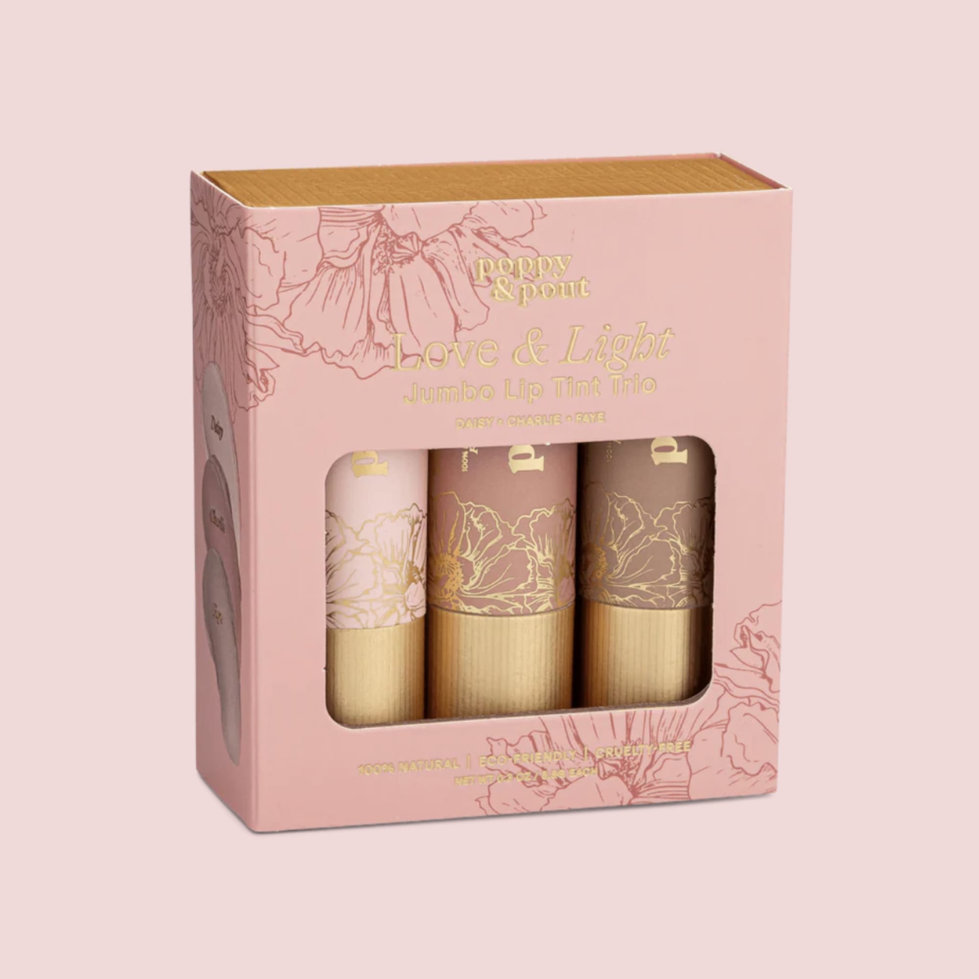 Pink boxed set of three jumbo lip tints with floral illustrations and a clear window.