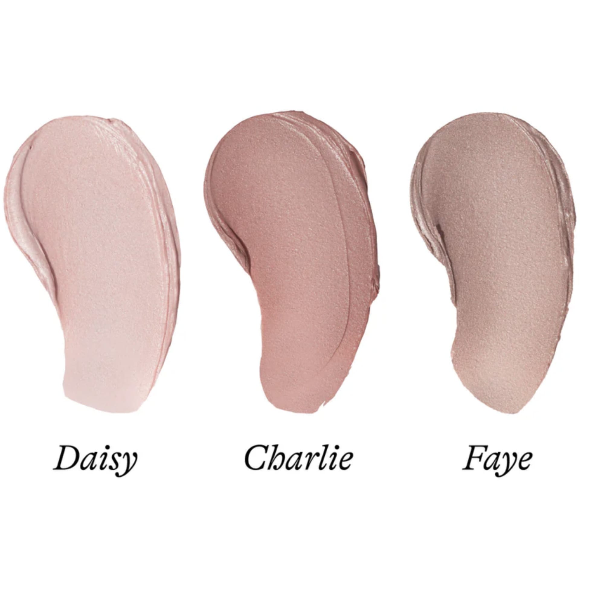 Three swatches of cream makeup in soft pink and nude shades labeled Daisy, Charlie, and Faye.