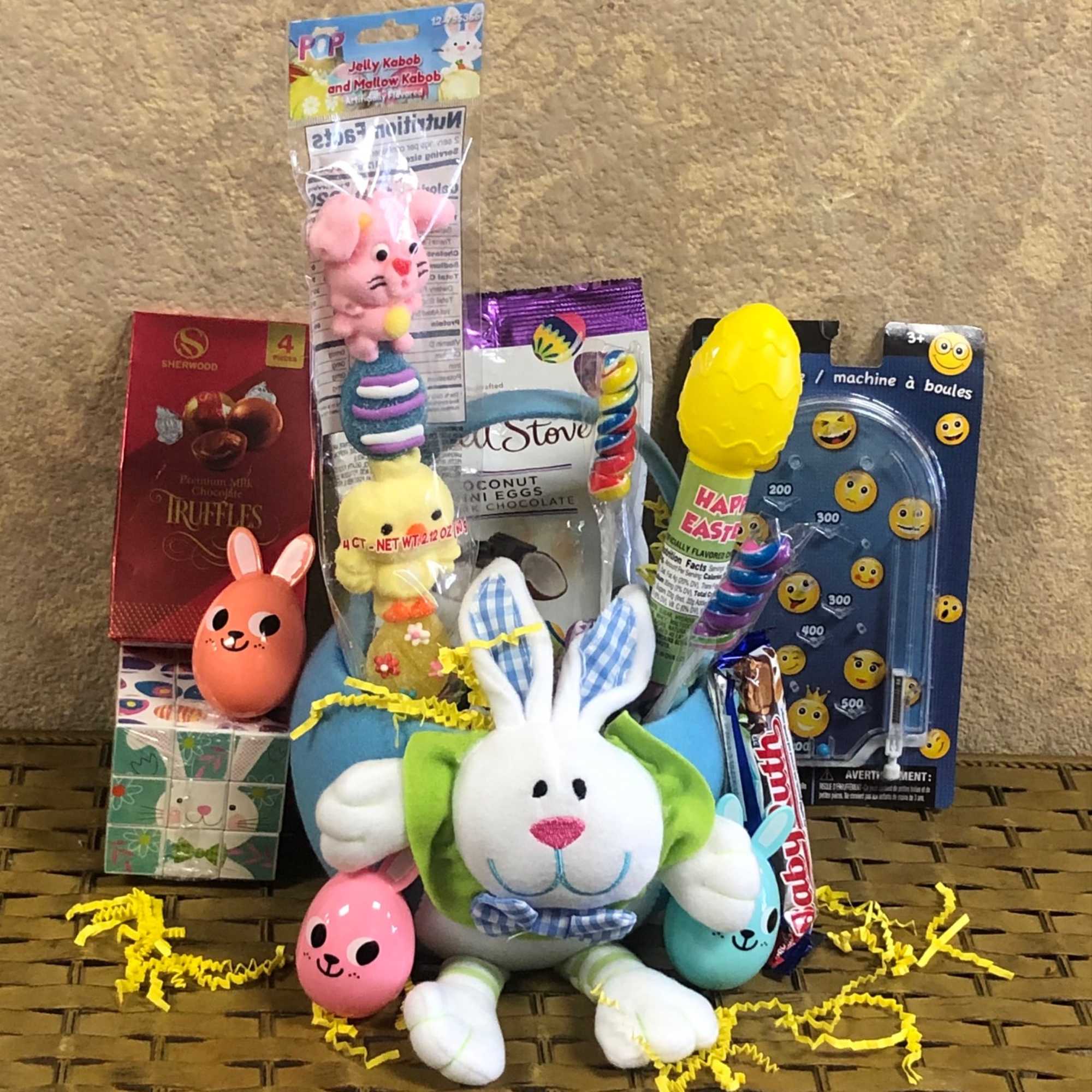 Easter candy and toys in a cute fabric Easter-themed basket. Please specify