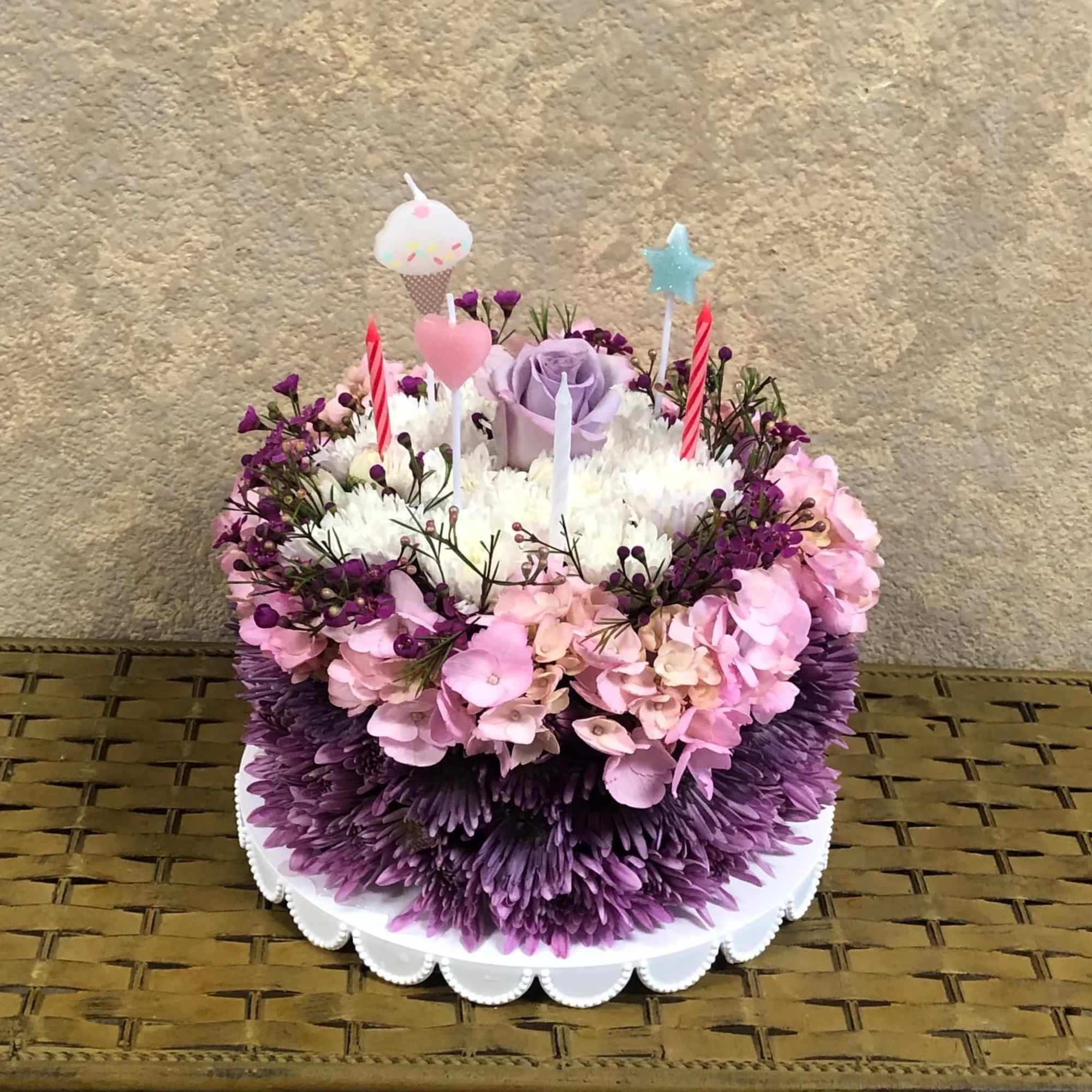 Our floral birthday cake may look good enough to eat, but it's