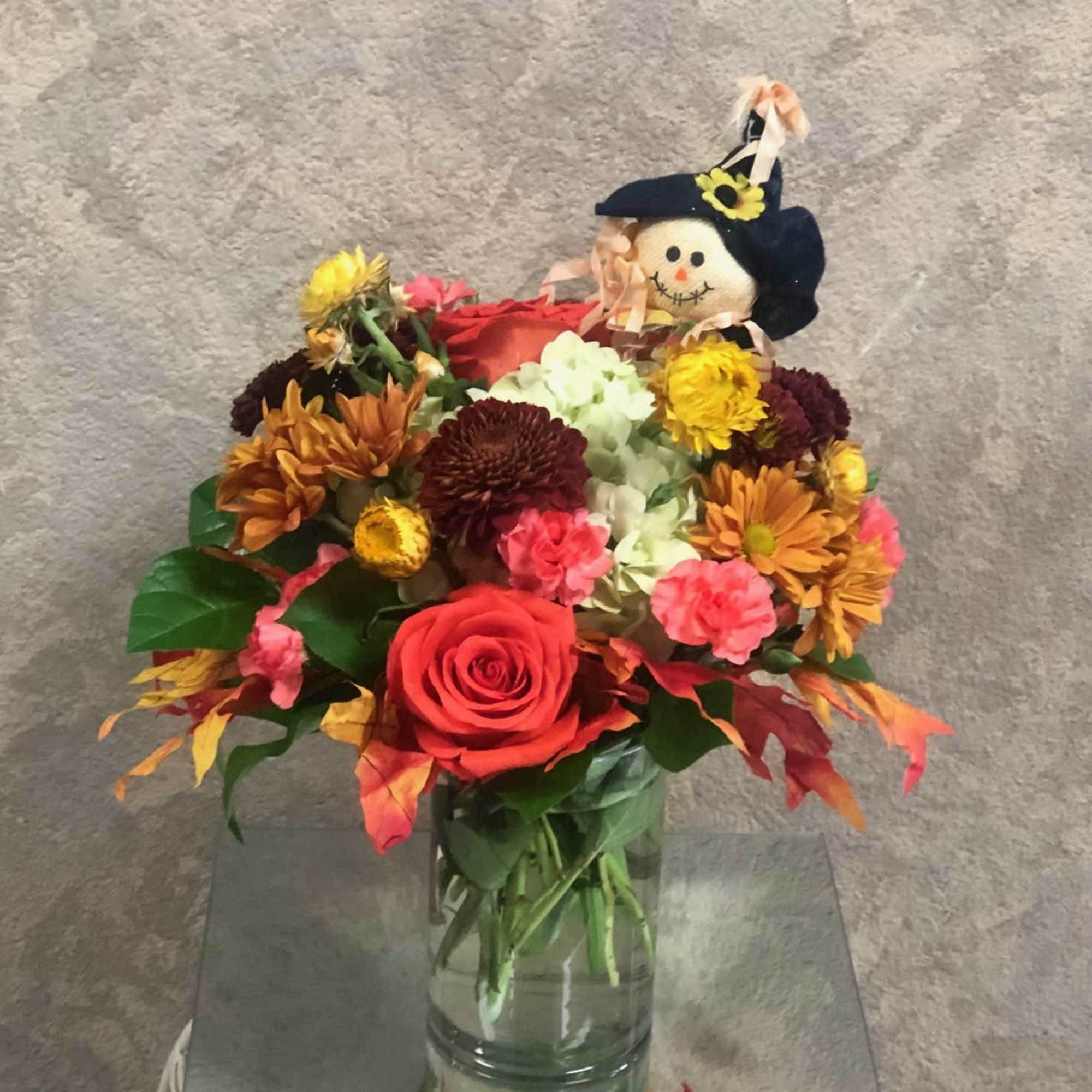Arrangement for fall with silk fall leaves, hydrangea, carnations, roses, strawflowers, daisies, photo 2 of 2