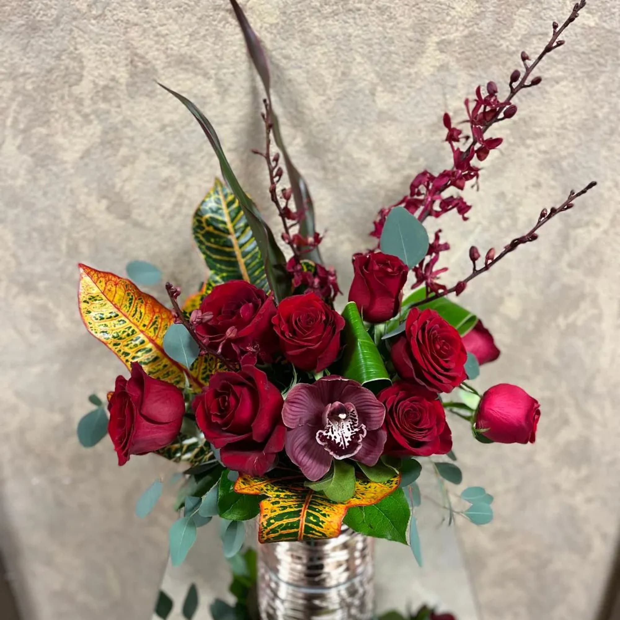 Type of Flowers: Red Roses, Cymbidium Orchids, and Phaleophesis Orchids in a
