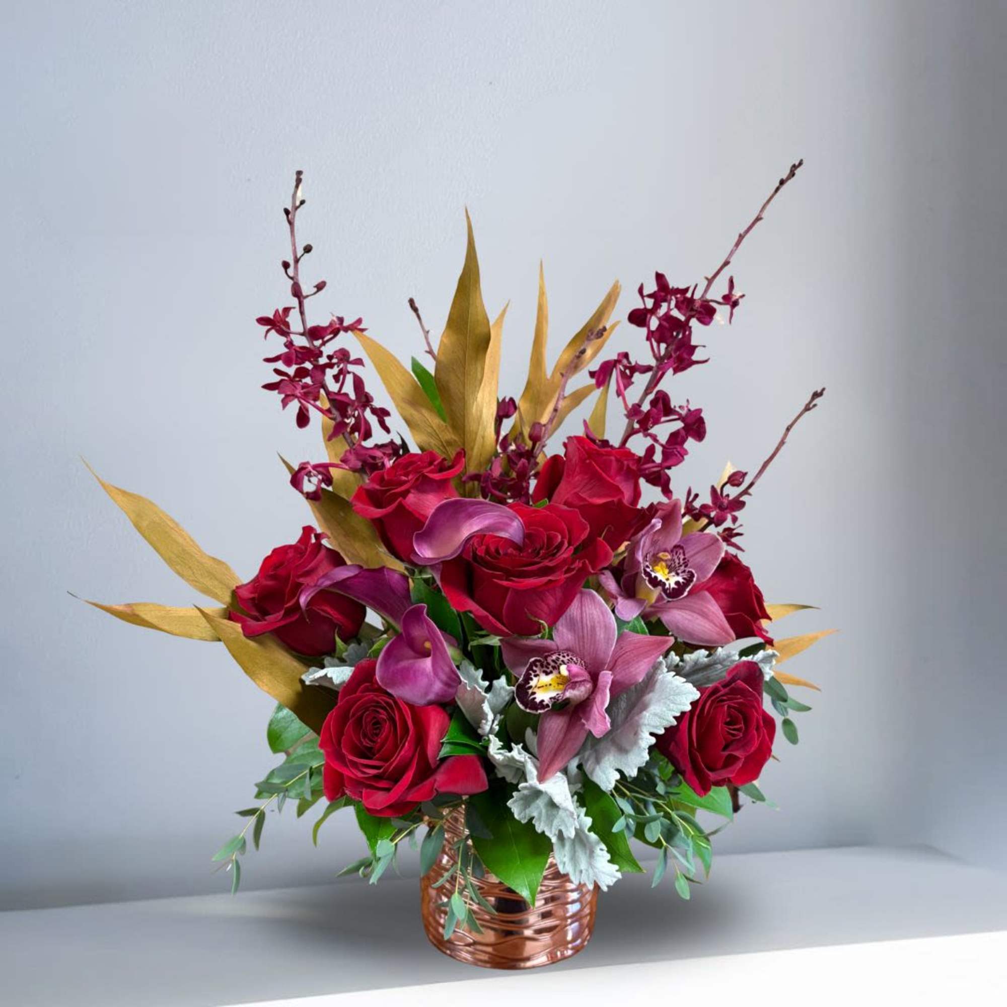 Type of Flowers: Red Roses, Cymbidium Orchids, and Phaleophesis Orchids in a