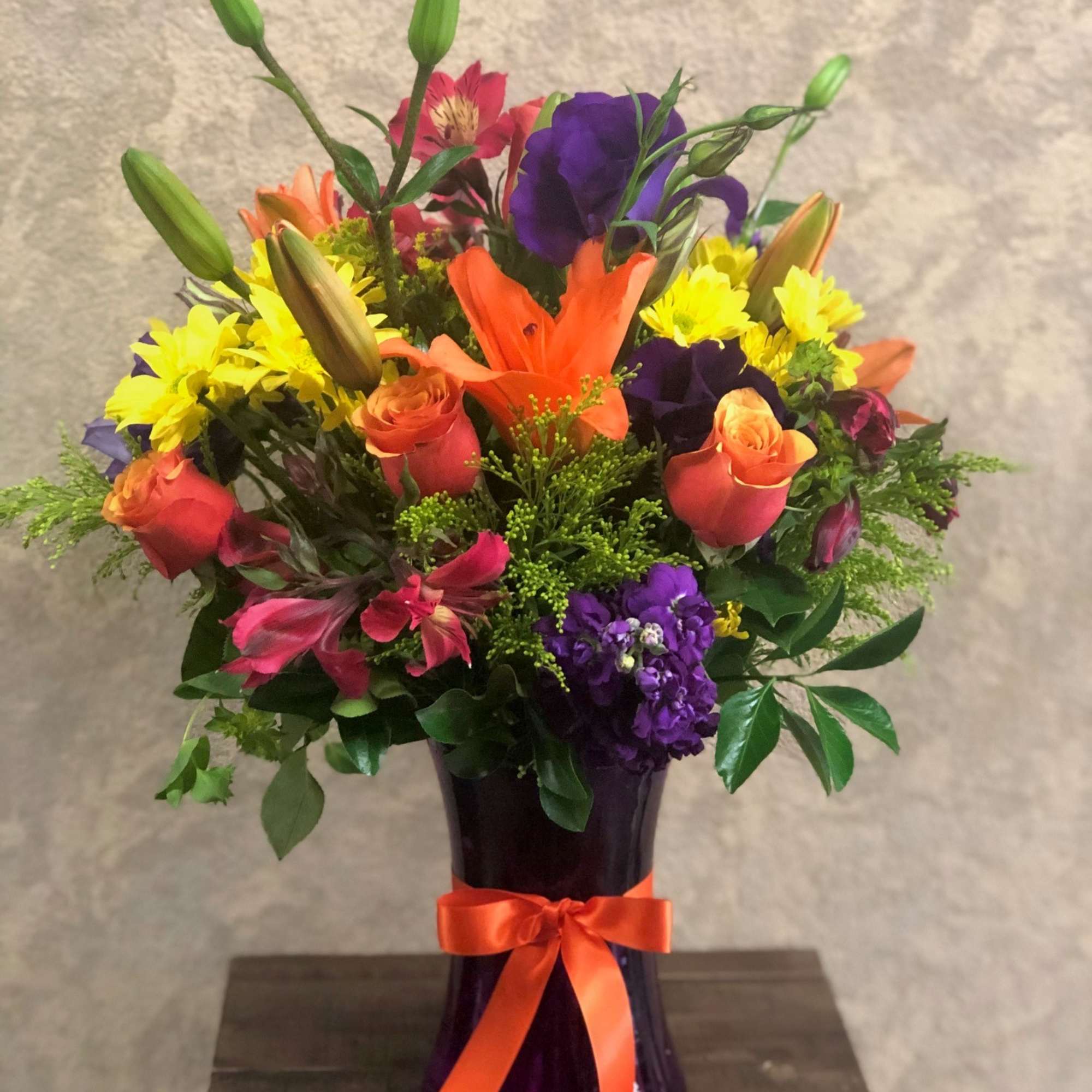 Type of Flowers: Purple Stock, Coral Roses, Orange Lilies, Purple Lisianthus, Pink