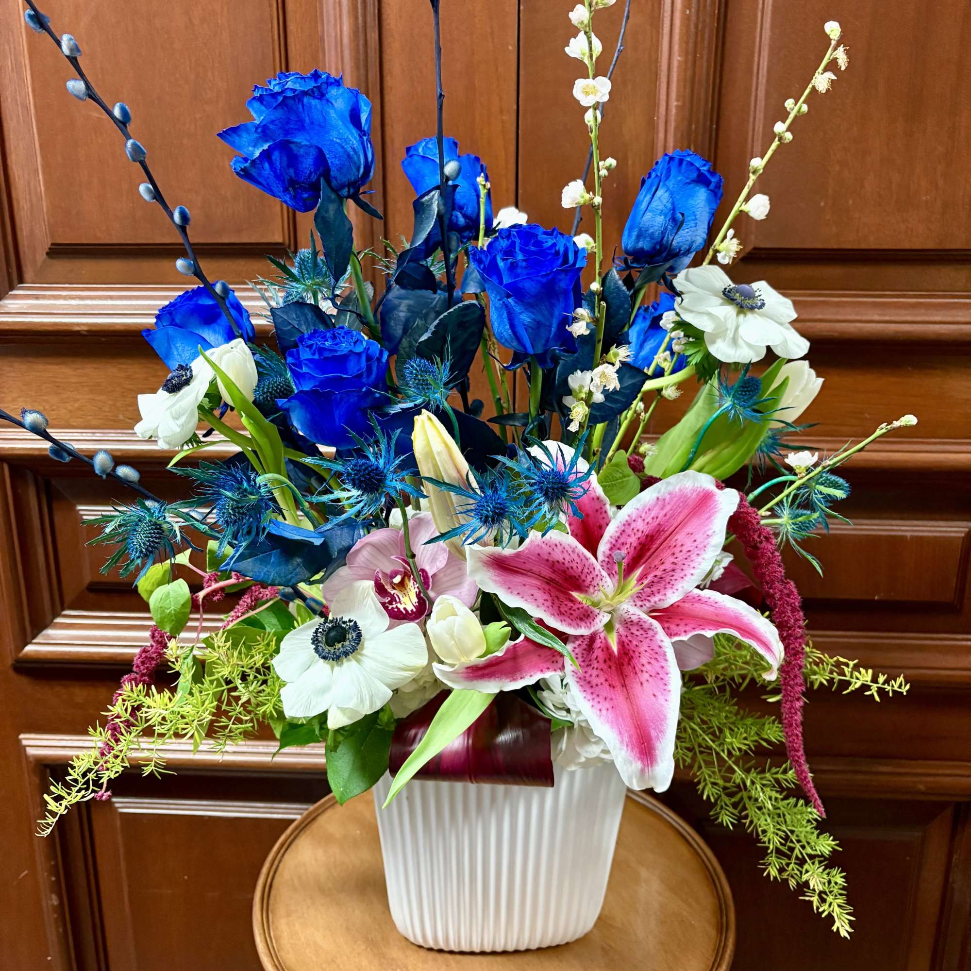 Recipe: Blue Roses, White seasonal anemones, Stargazers, Amaranthus in a tall, white, photo 3 of 3