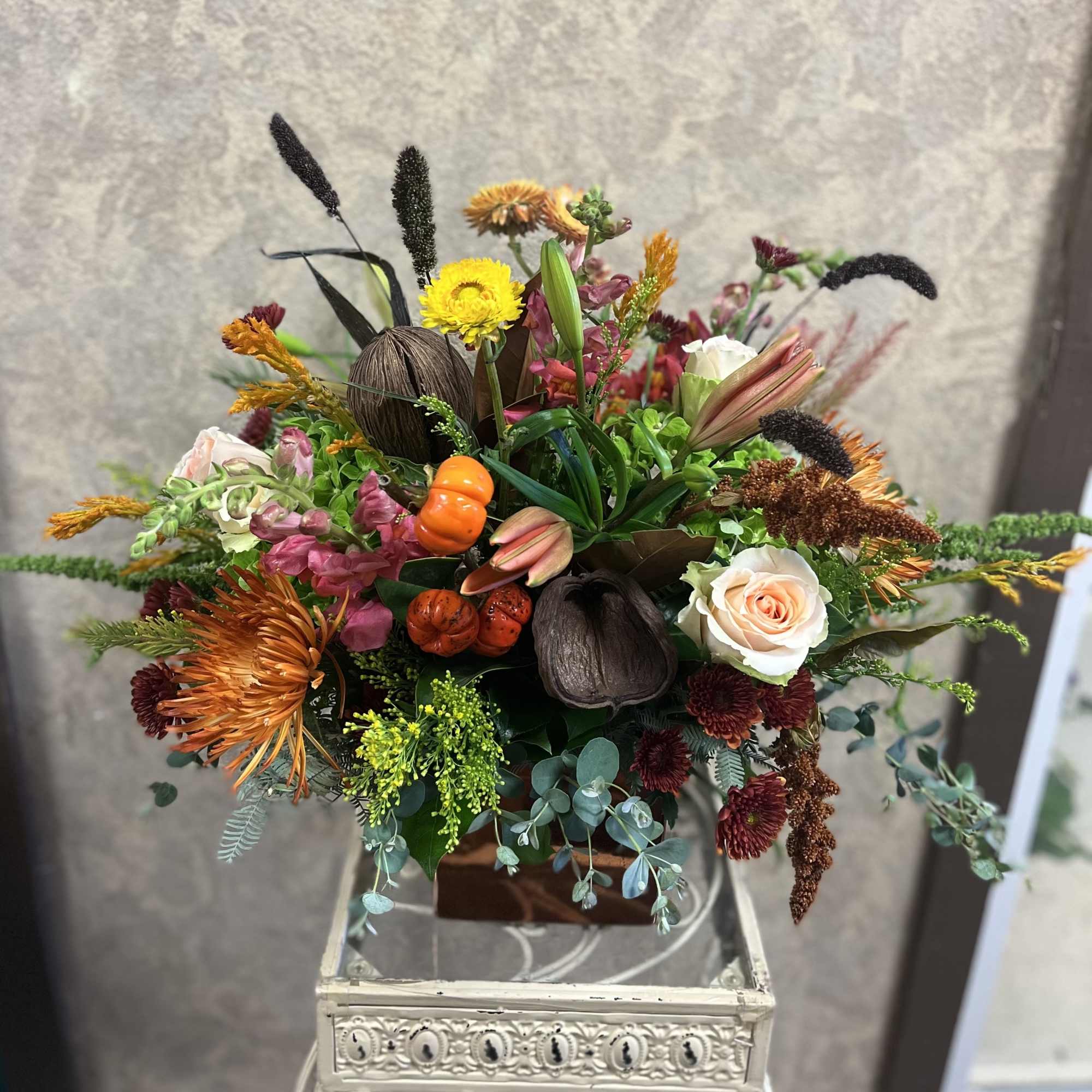 This Thanksgiving, gather around this wildly vibrant, fall centerpiece that includes fresh
