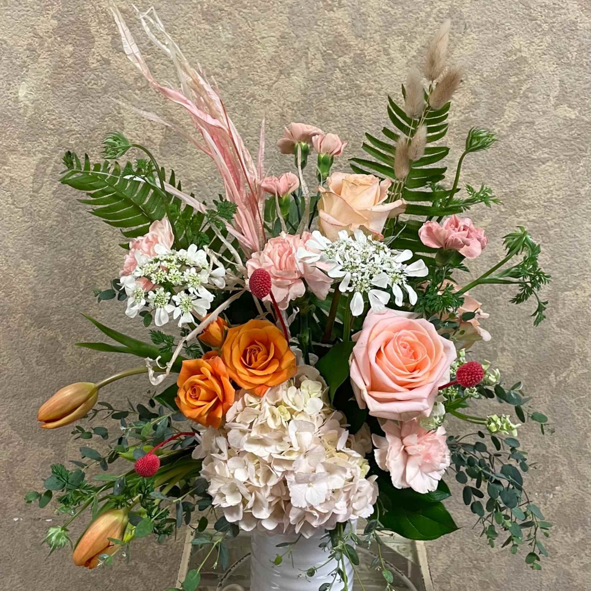 Type of Flowers: Peach Roses, Pink Hydrangeas, Pink Carnations, Orange Spray Roses