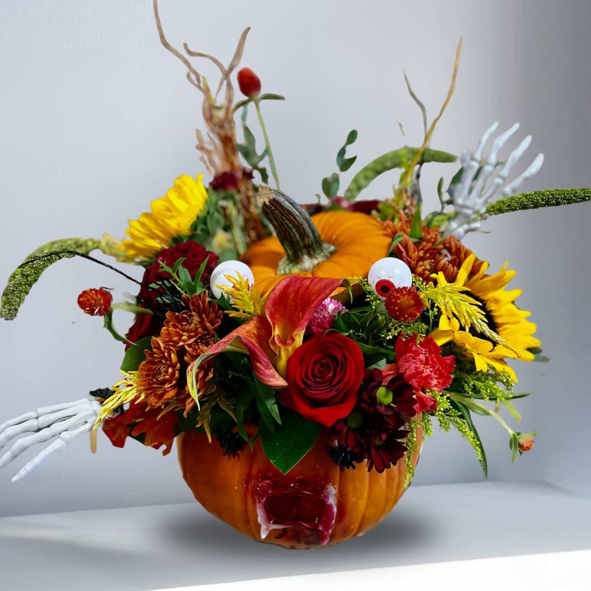 Type Of Flowers: Red Roses, Black Calla Lilies, Sunflowers, Red Carnations, Brown