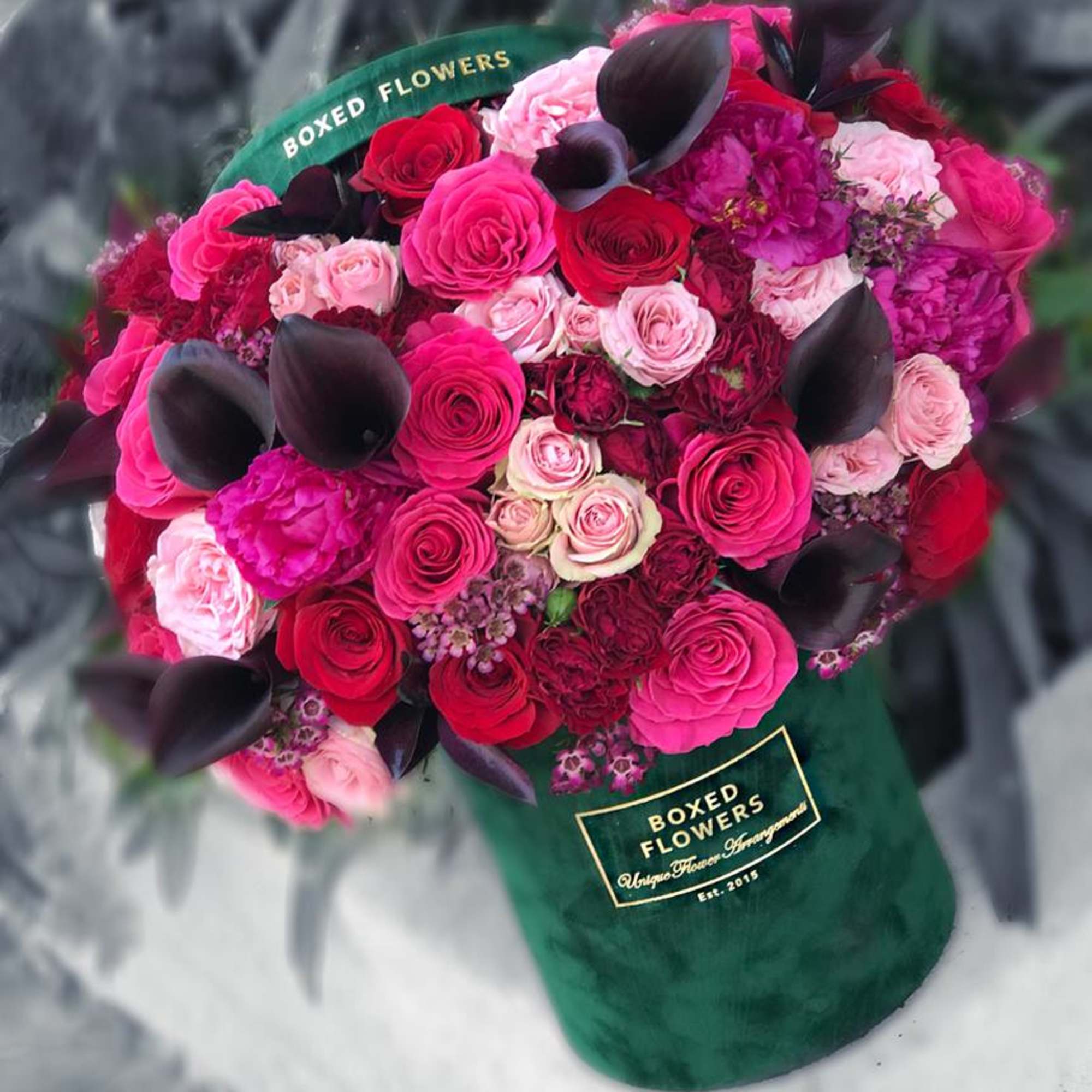 A gorgeous mix of hot pink, red and blush roses mixed with