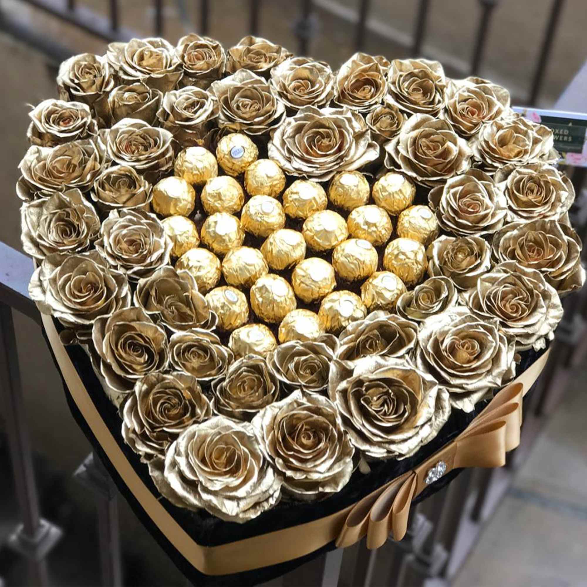 Heart-shaped box of gold roses with Ferrero Rocher chocolates in the center