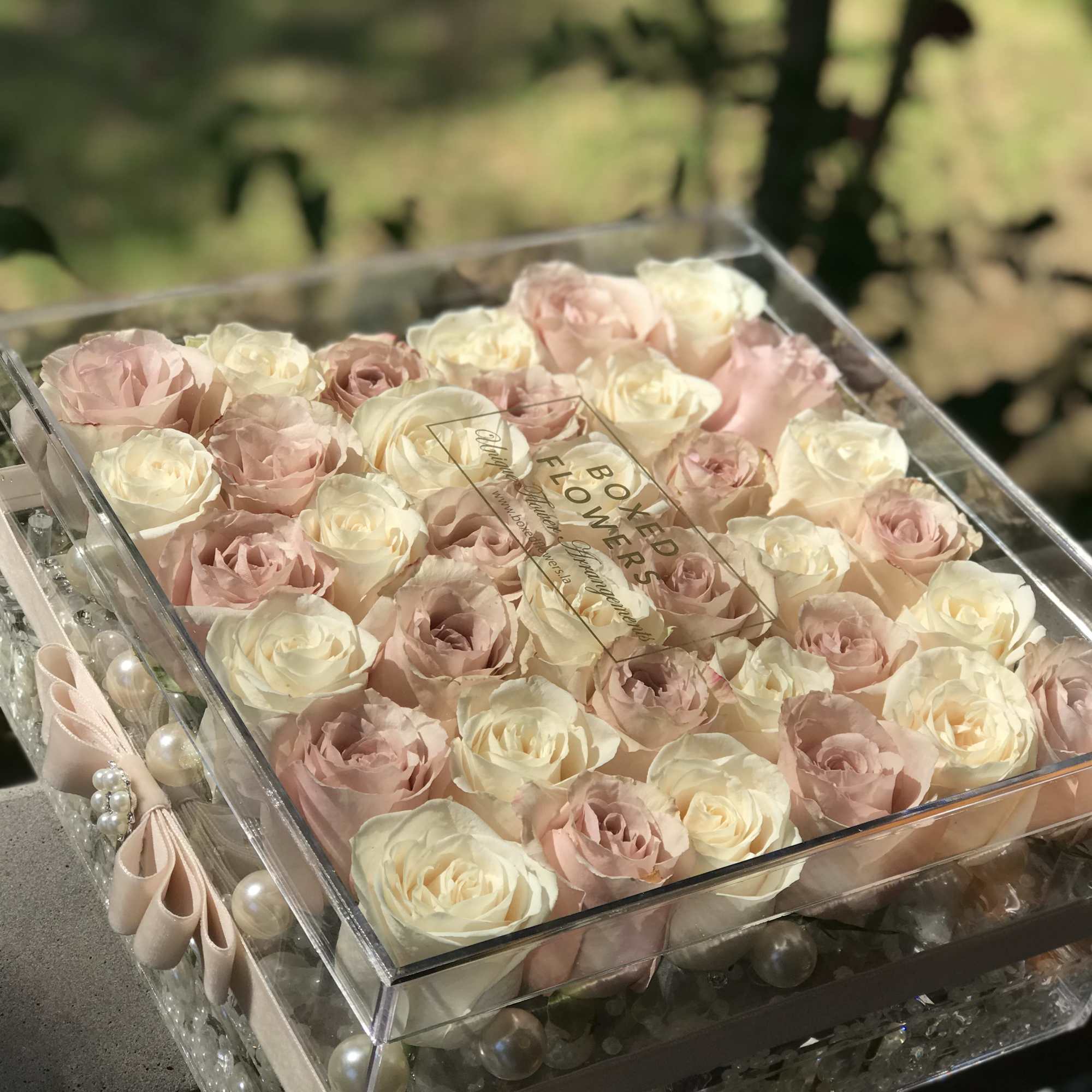 Pure elegance is class is presented with each signature acrylic rose box.