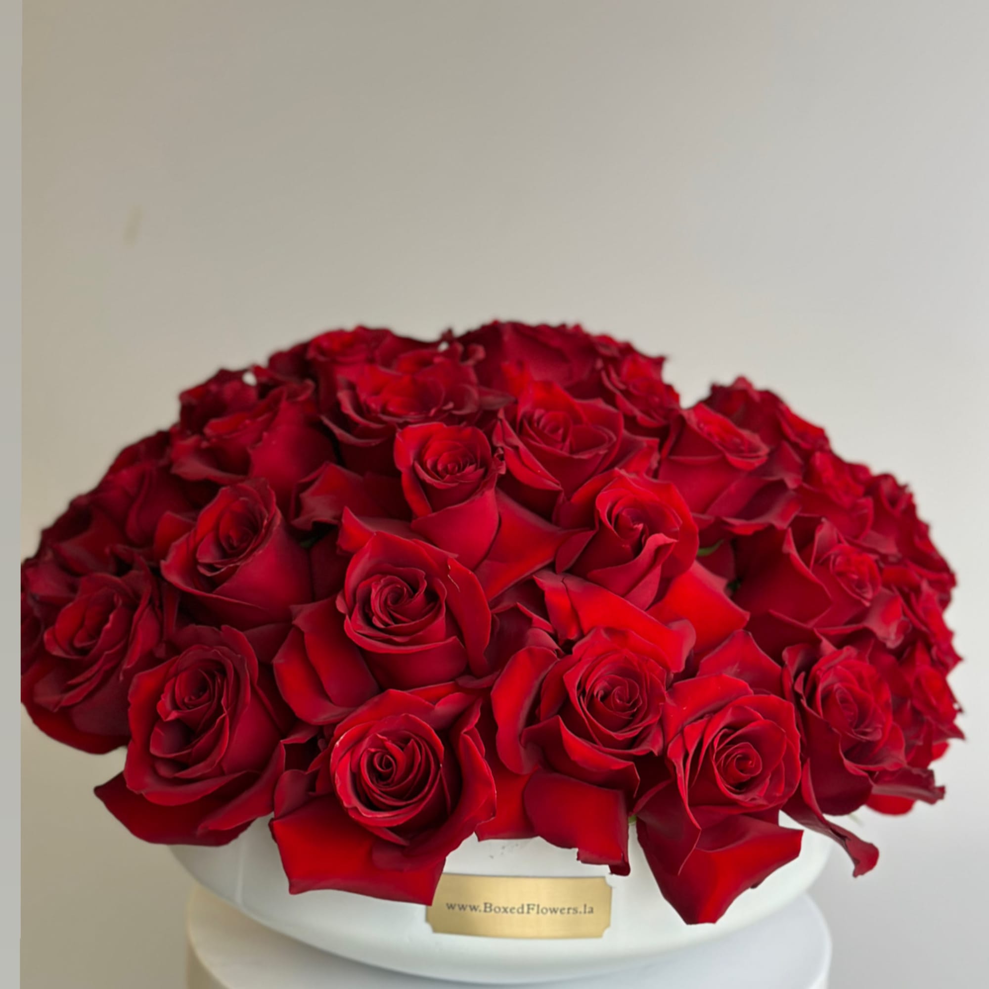 Large dome bouquet of red roses in a white box