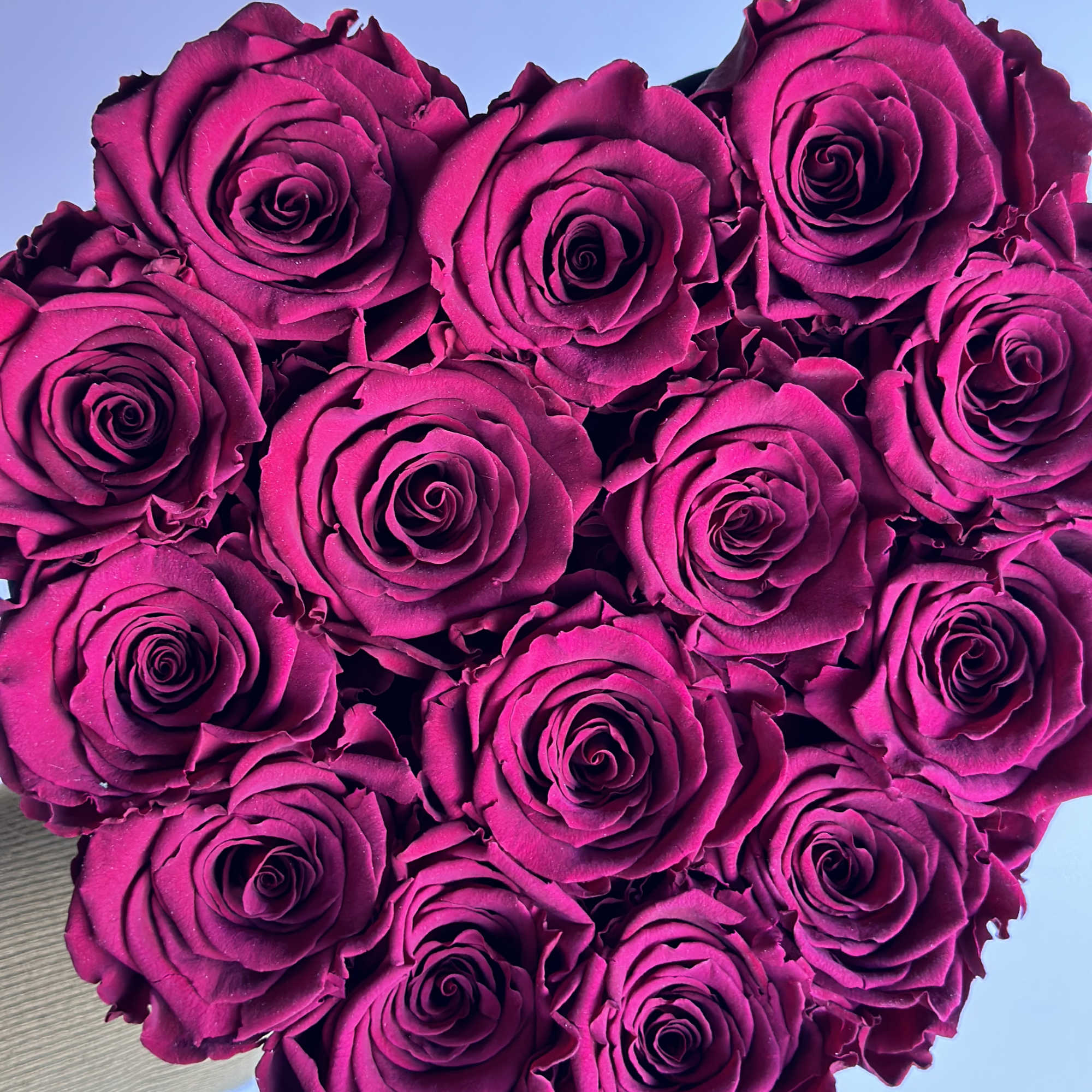 Heart-shaped bouquet of magenta roses
