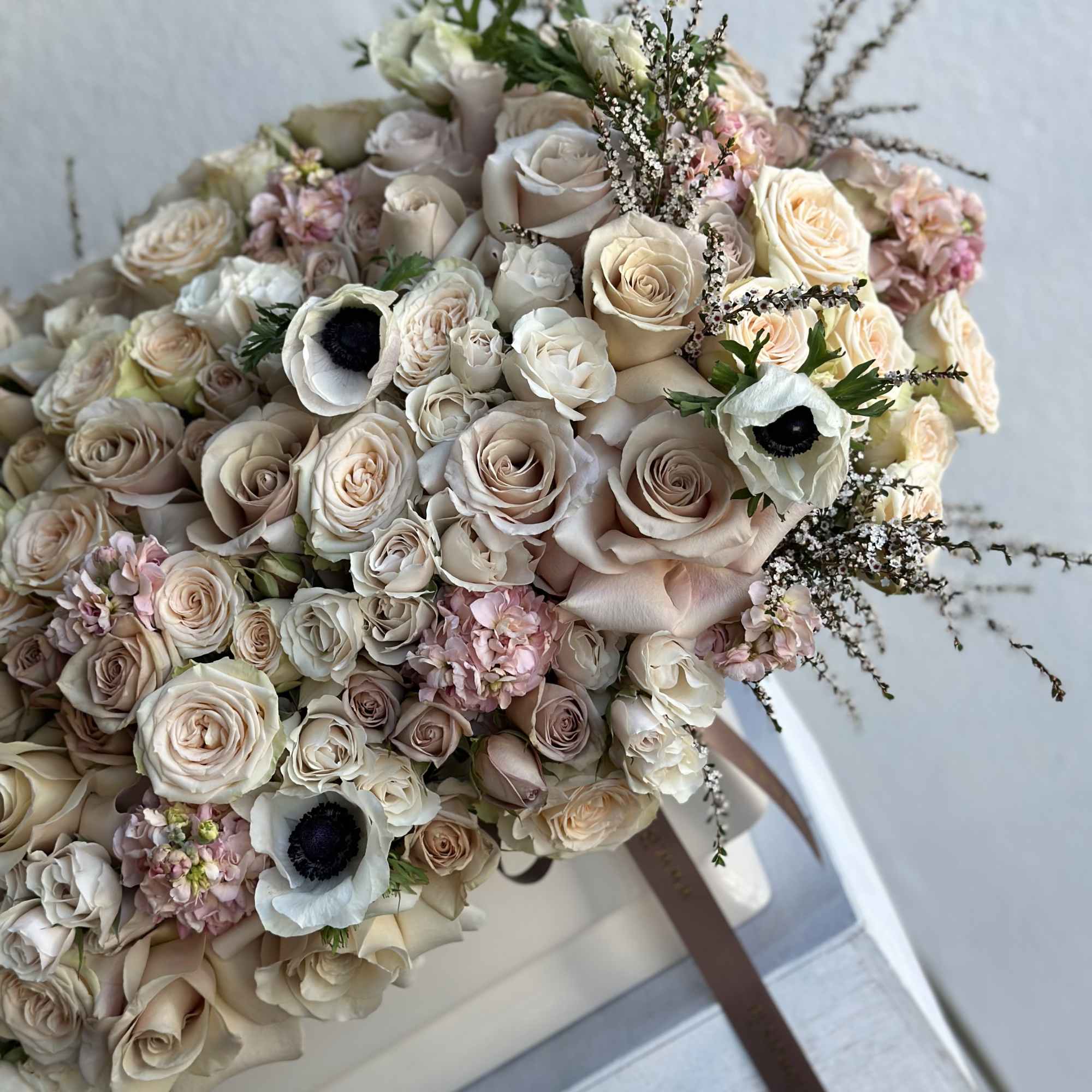 Beautiful, earthy tones, quicksand roses, anemones,  stock,  spray roses, all
