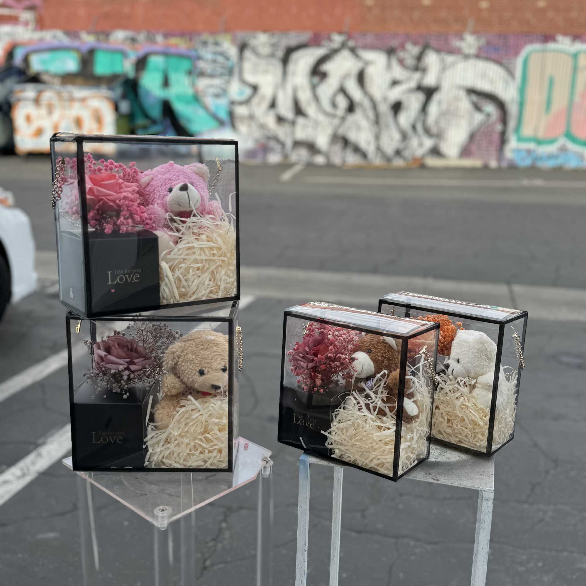 Gift boxes with teddy bears and pink roses