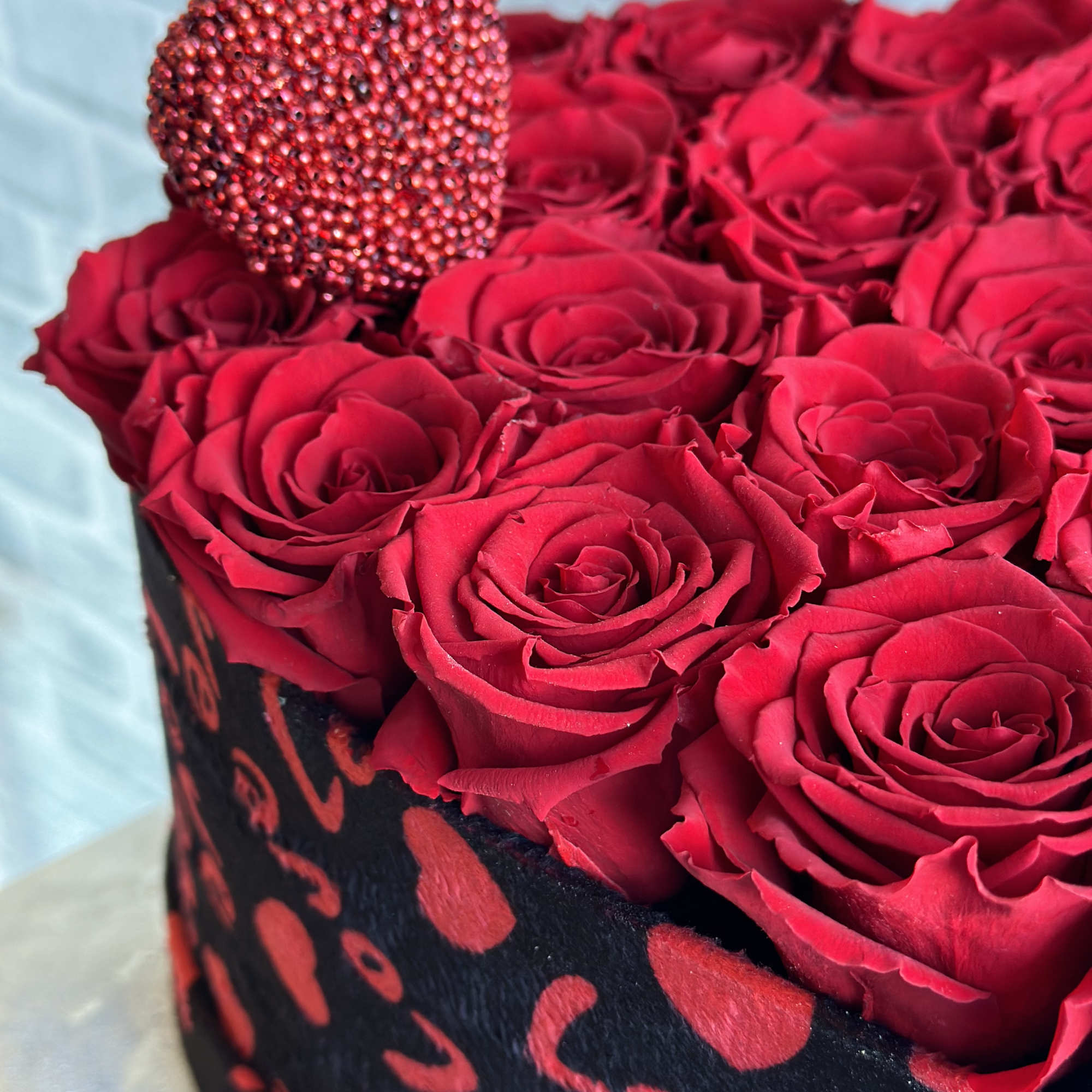 small beautiful velvet print heart box with approx 25 roses. 