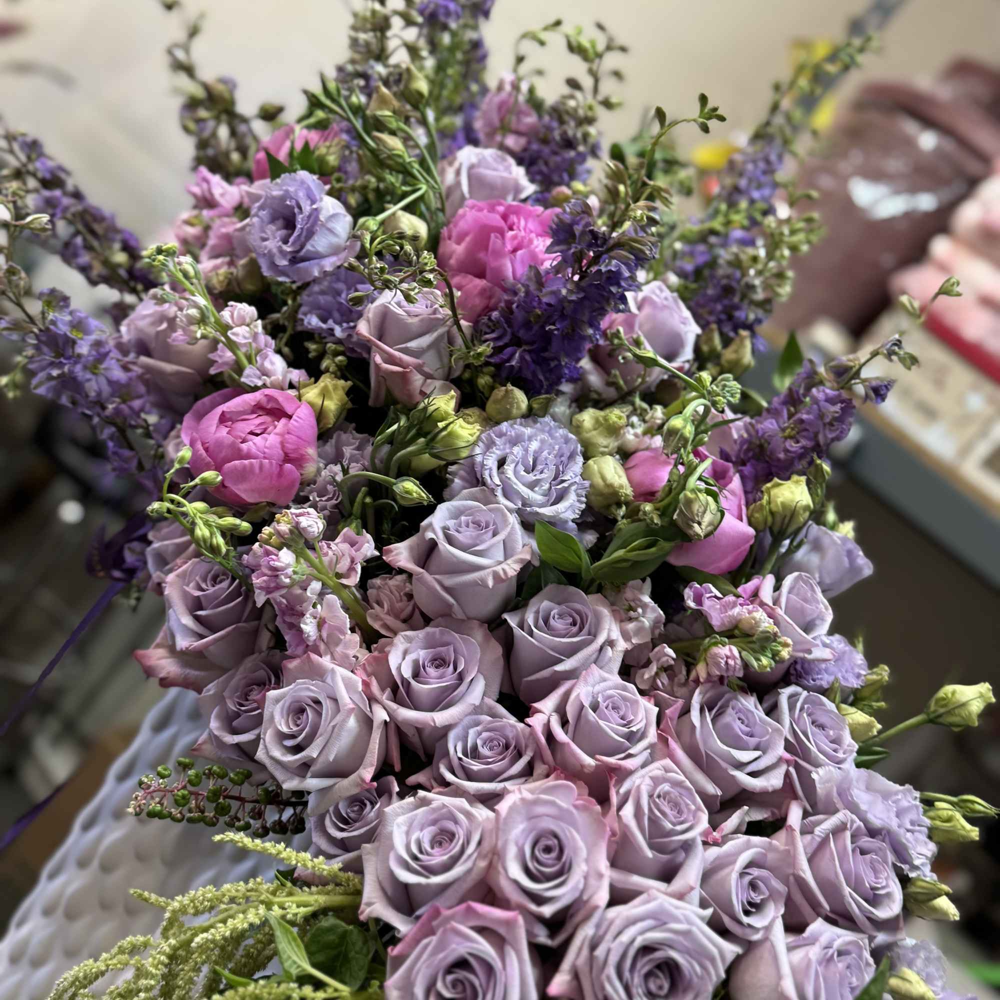 Bouquet of lavender and pink roses with purple flowers