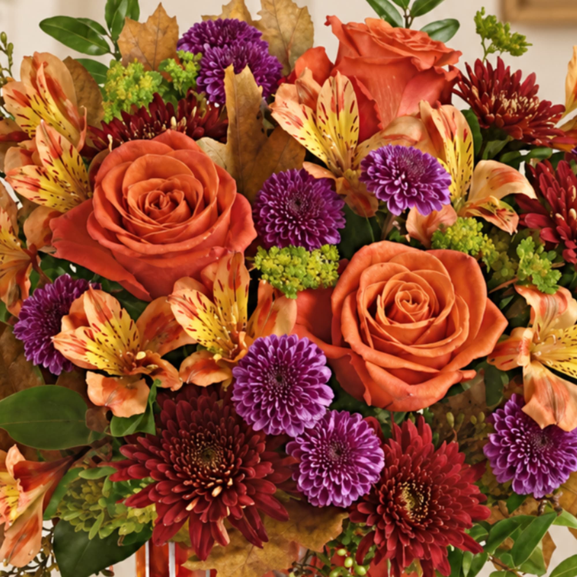 Bouquet of orange roses, purple mums, and striped alstroemeria