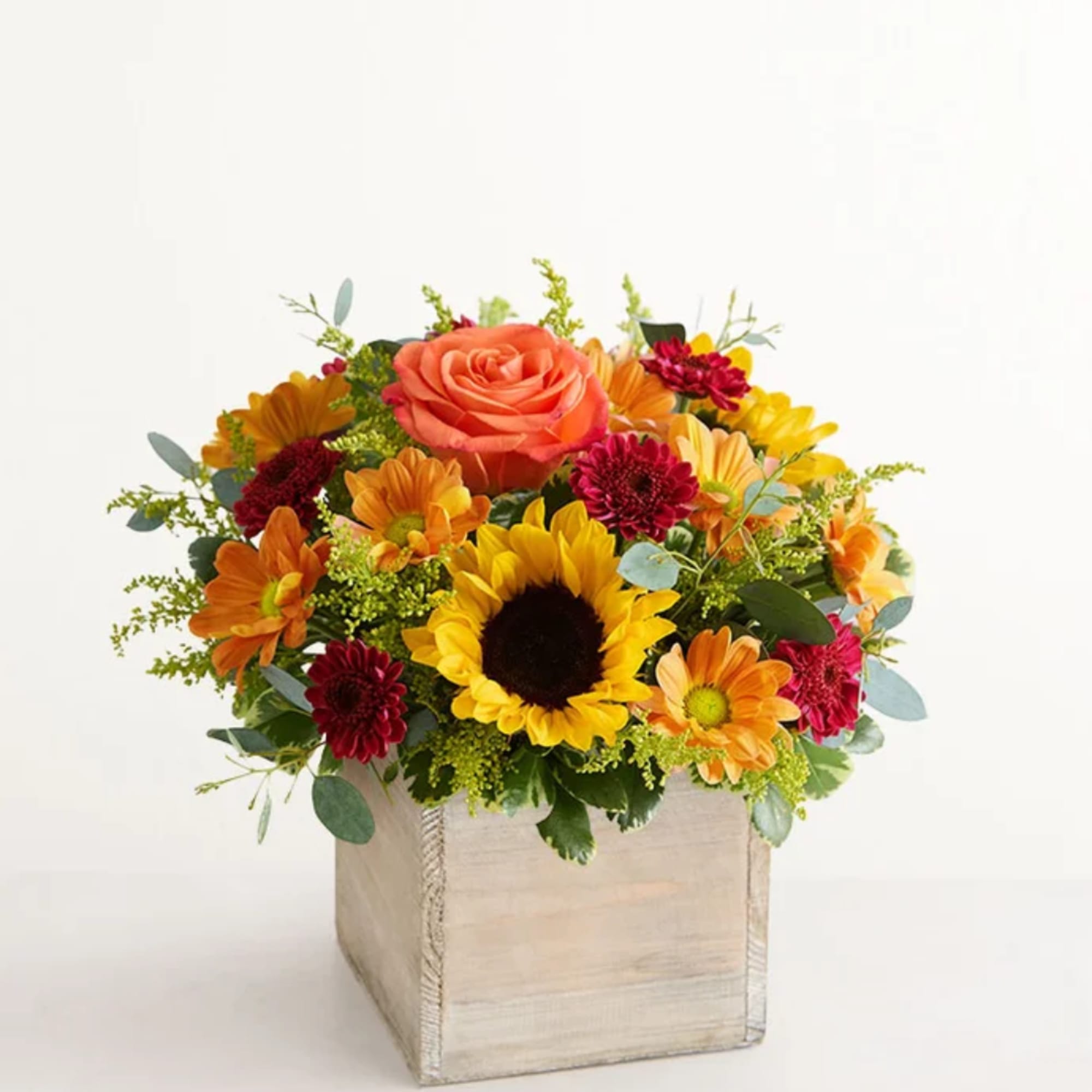 Mixed bouquet with a sunflower and orange rose in a square wooden box