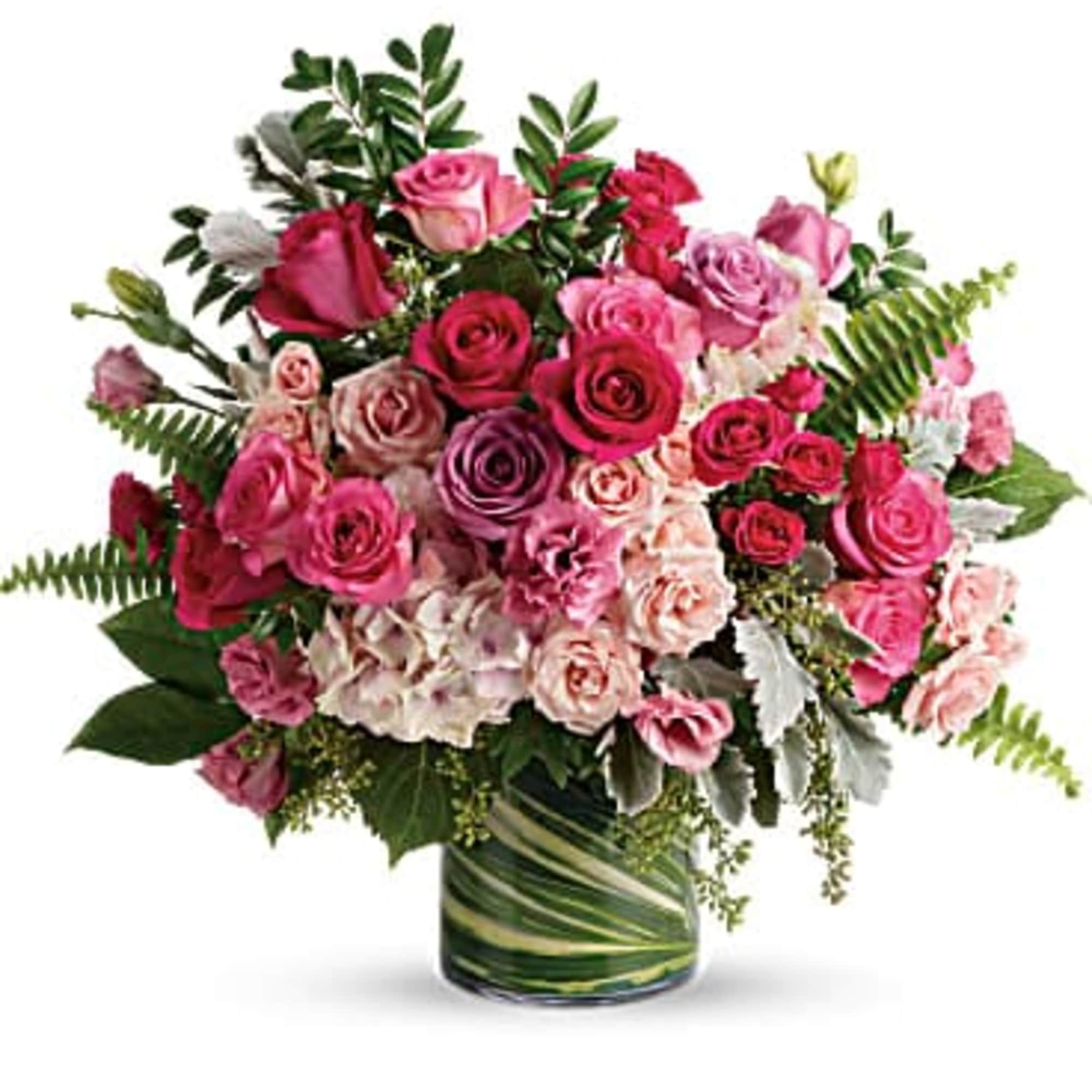 Pink and red rose bouquet in a glass vase
