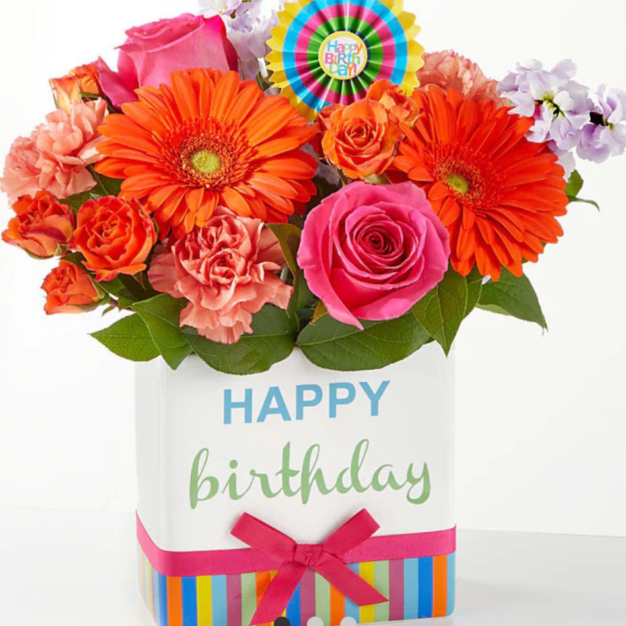 Birthday bouquet in a white gift box with bright mixed flowers