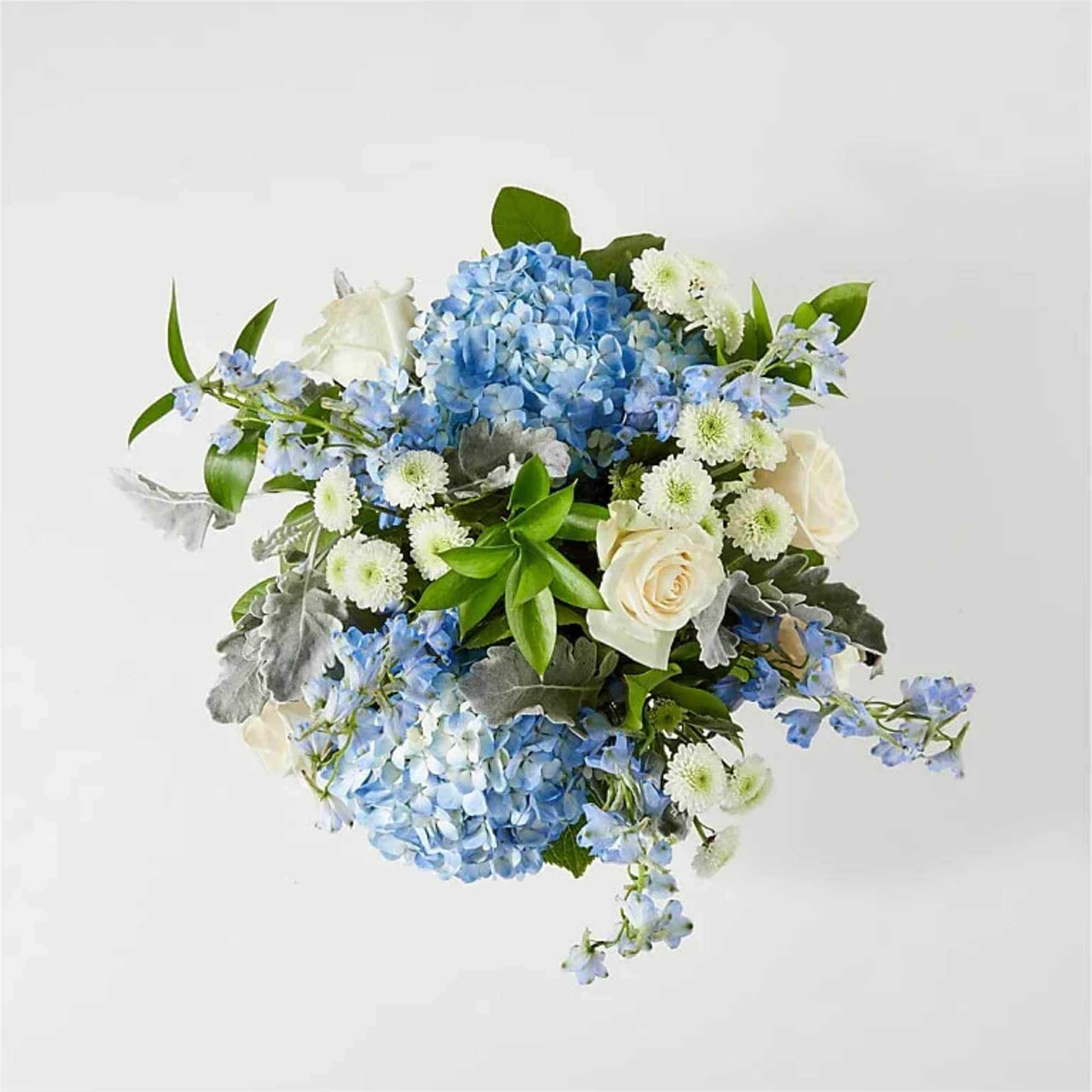 Blue hydrangea bouquet with white roses and small white daisies