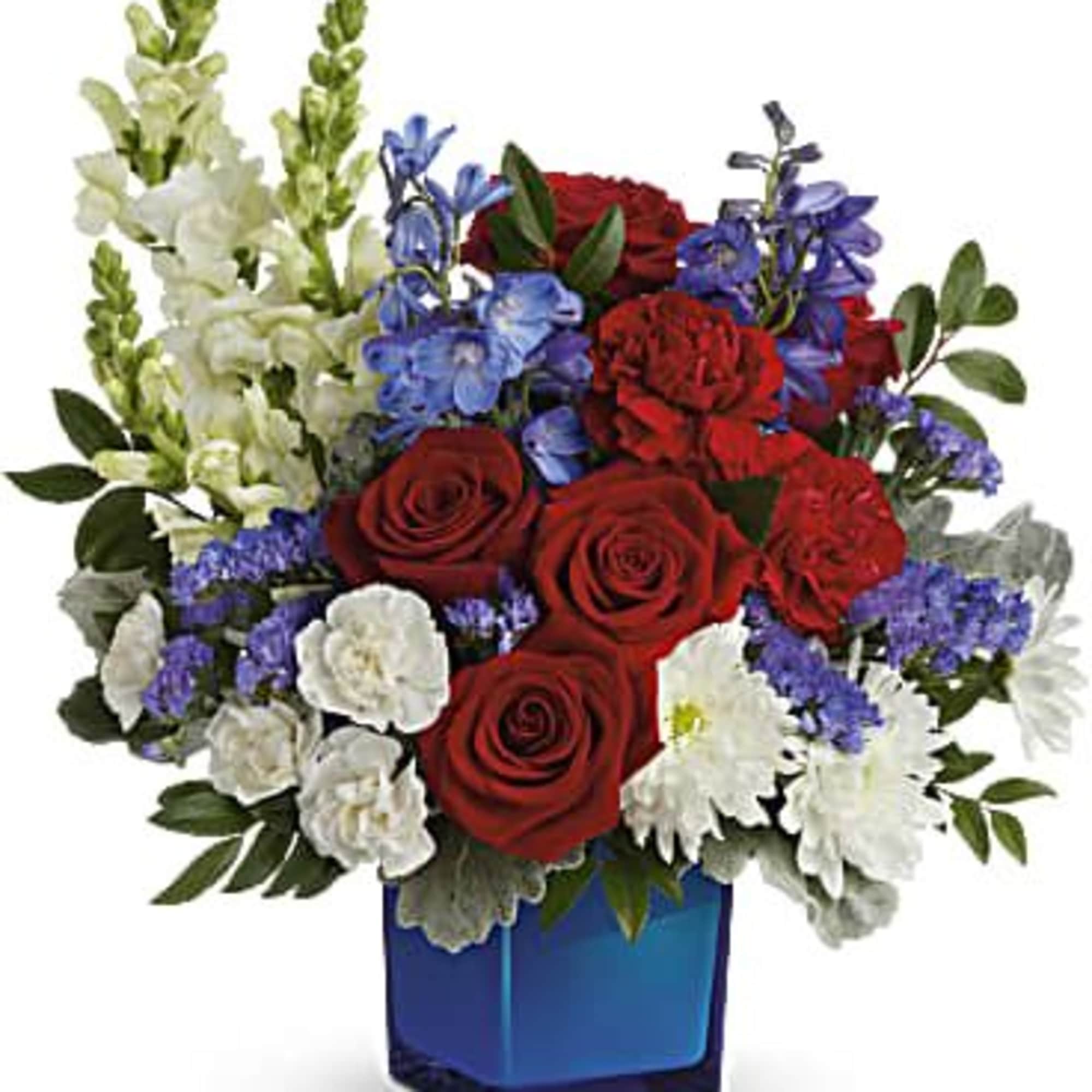 Red roses with white and blue flowers in a blue glass vase