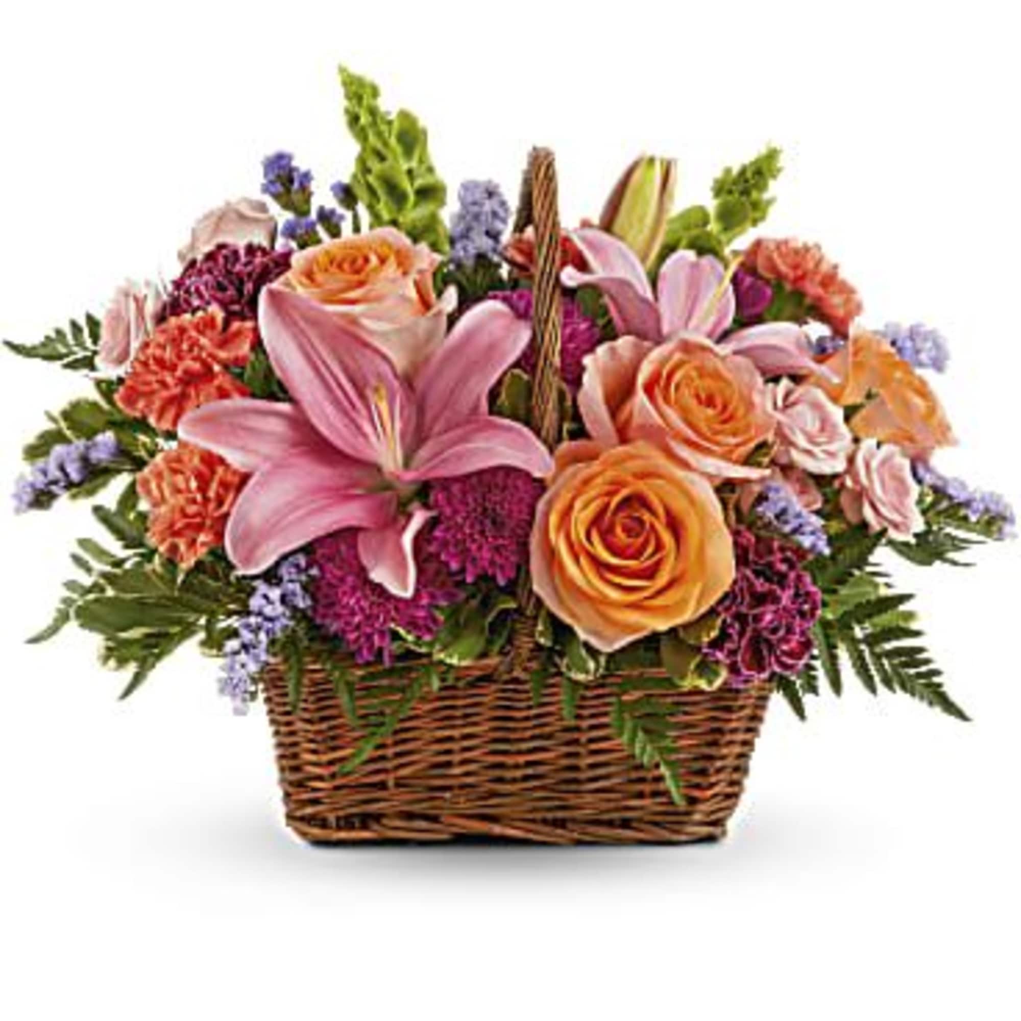 Mixed flower basket with pink lilies and peach roses