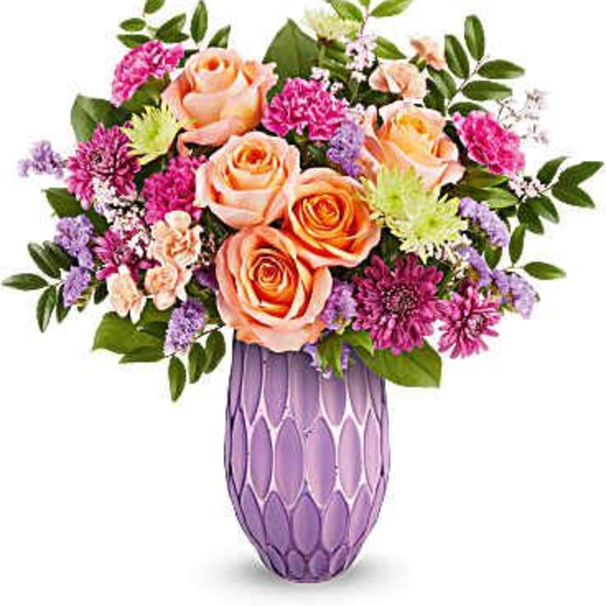 Peach roses and purple flowers in a lavender vase