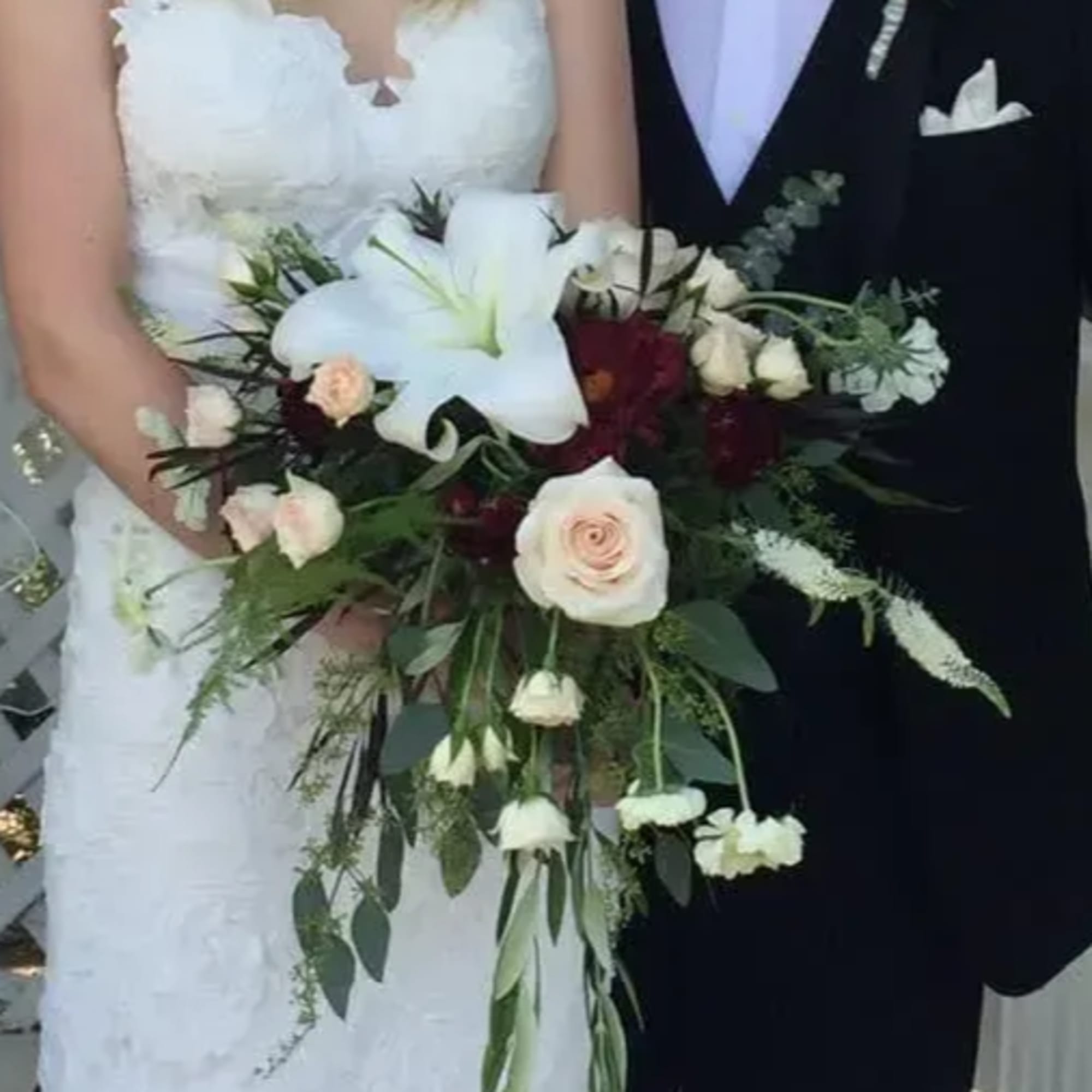 This special wedding bouquet includes seasonal dahlias, lilies, roses, lisianthus, and mini, photo 2 of 2