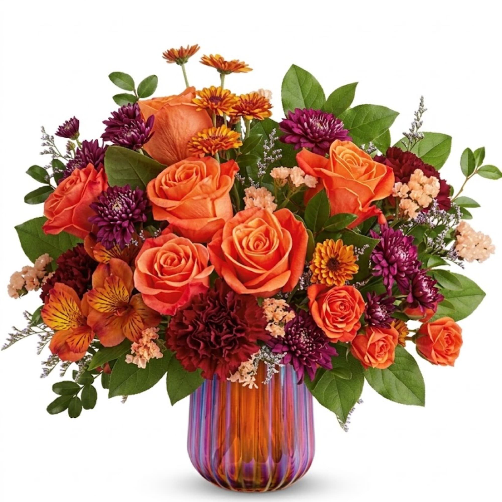 Orange roses and purple mums in a striped glass vase