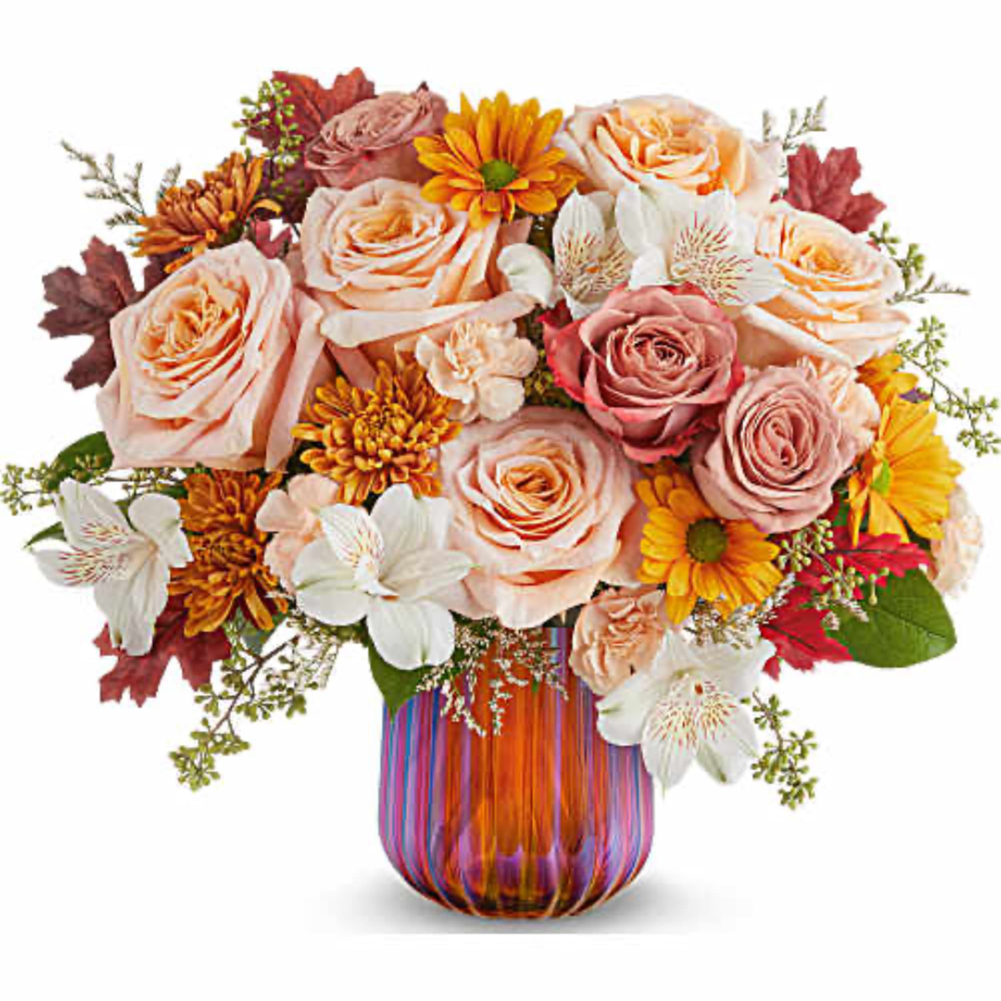Mixed bouquet of roses, daisies, and white orchids in a striped glass vase