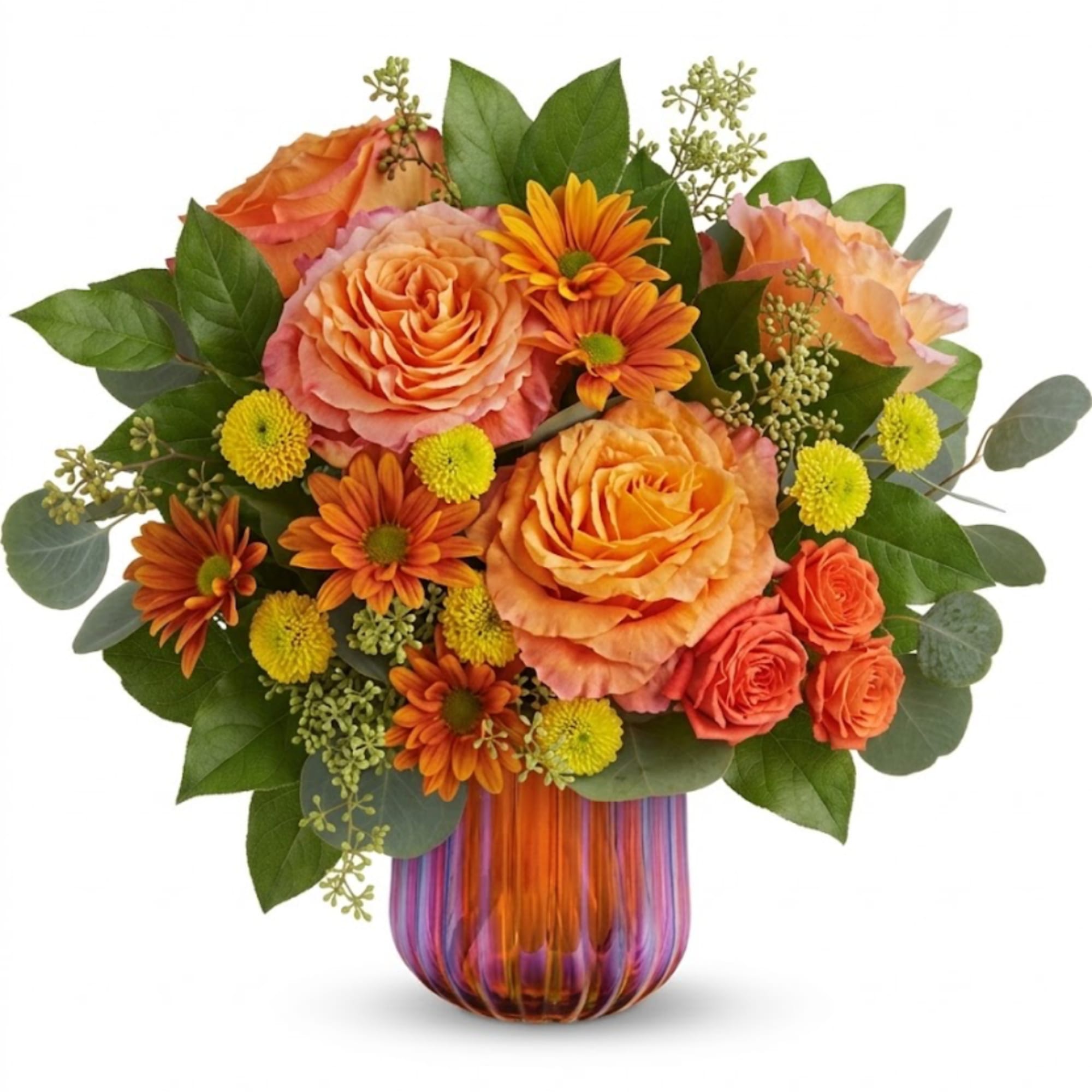 Orange roses and daisies arranged in a striped glass vase