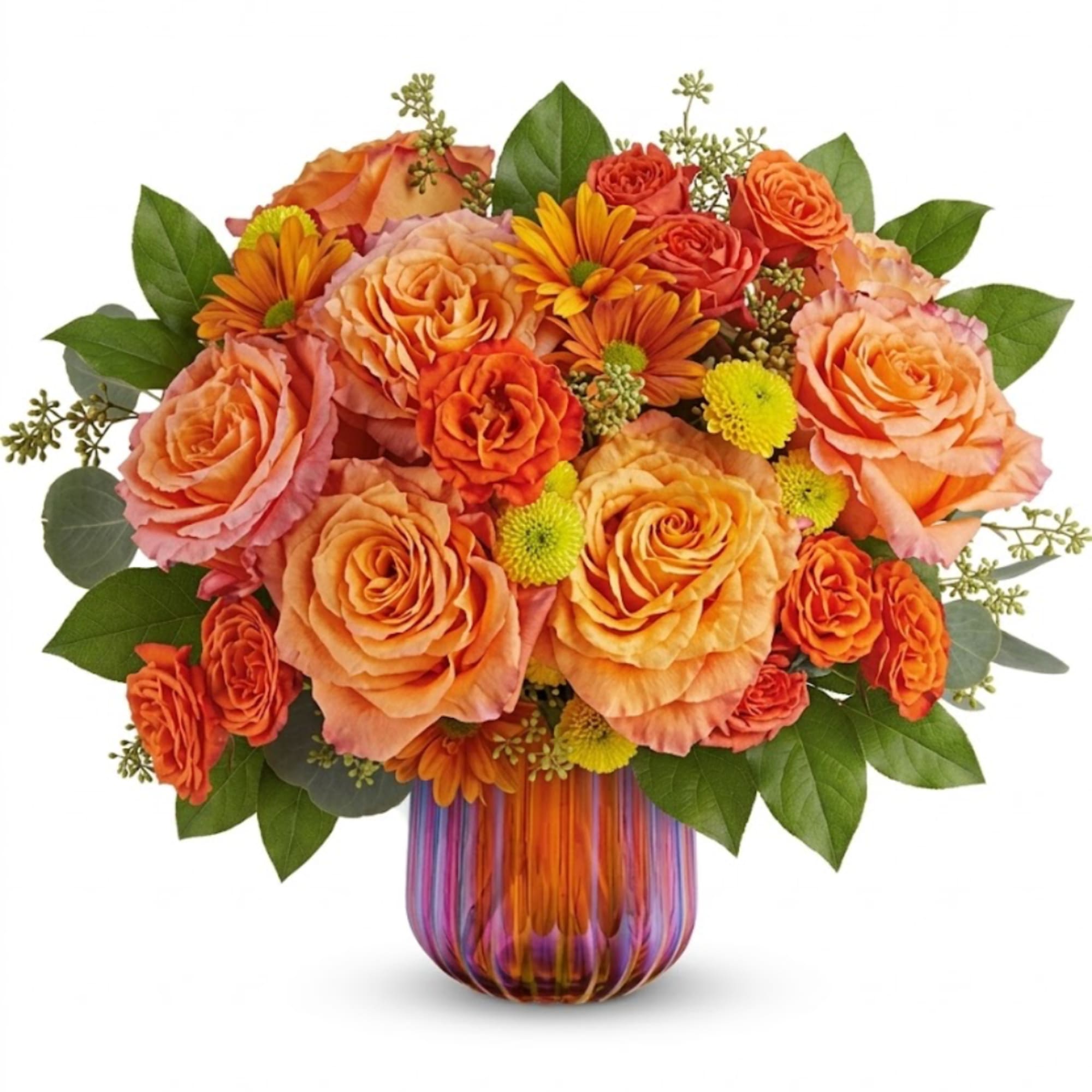 Orange and peach roses with daisies in a striped glass vase