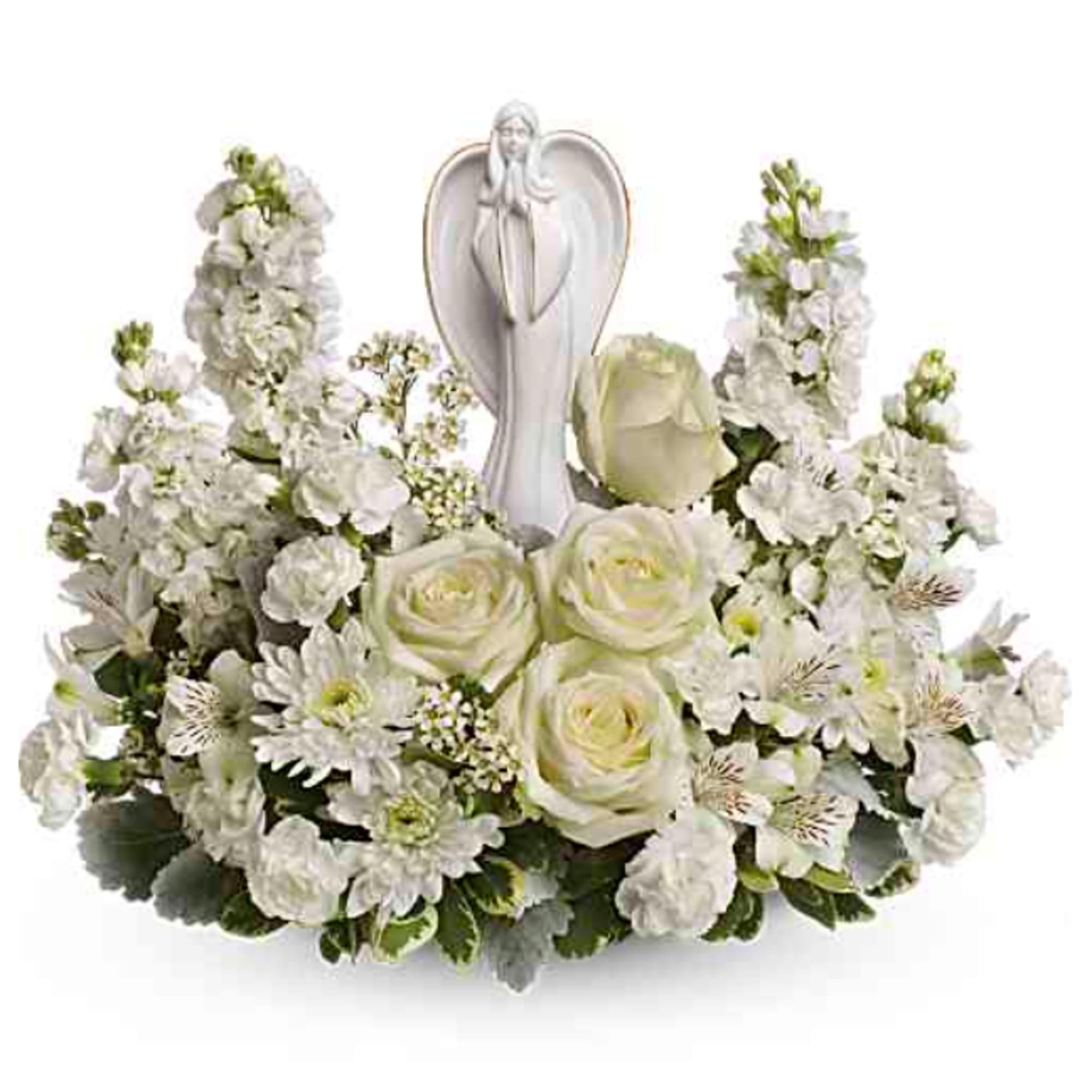 White floral arrangement with a praying angel figurine in the center